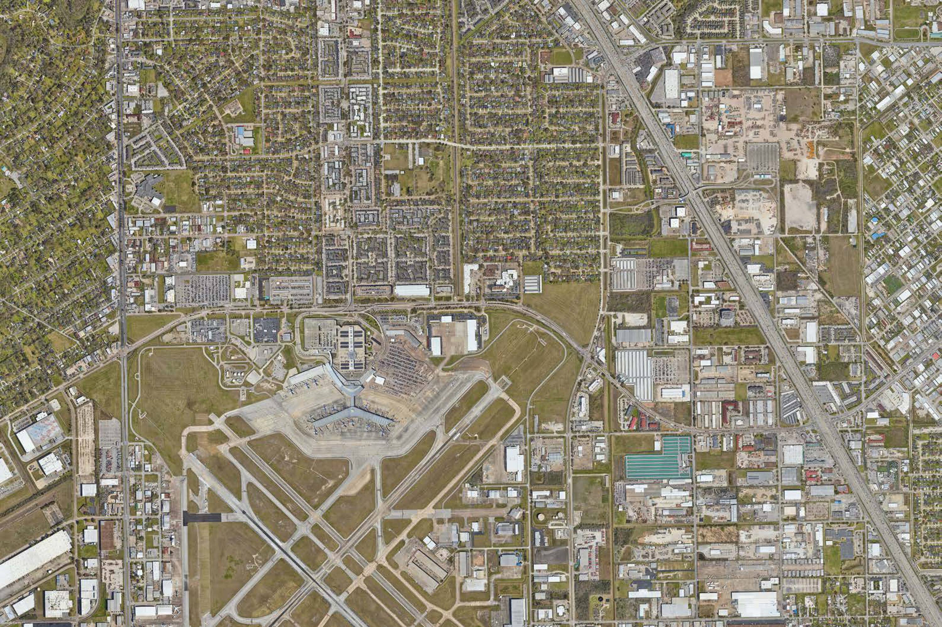 Aerial view of the vacant land property at 7625 Monroe Rd, Houston, TX, near George Bush Intercontinental Airport.