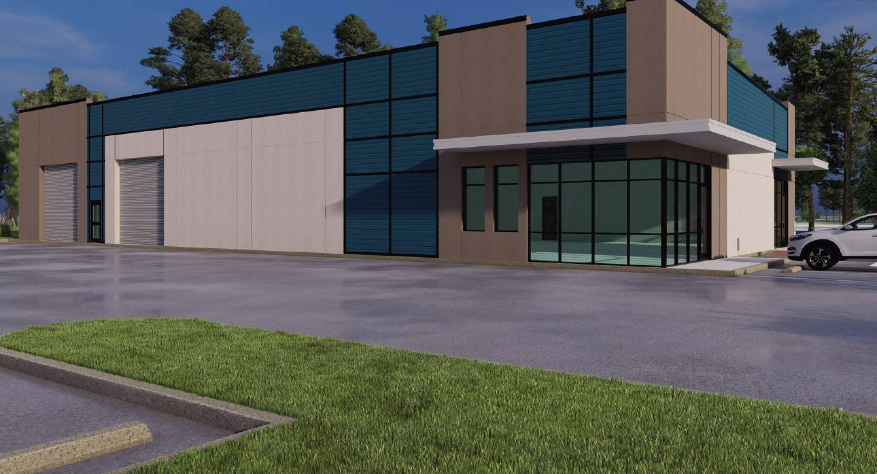 Modern industrial building with large windows, ample parking, and loading areas at Misty Valley Business Center in Houston, TX.