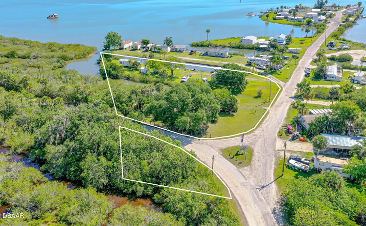 Pictures of Land property located at 416 E Halifax Avenue, Oak Hill, FL 32759 for sales - image #1