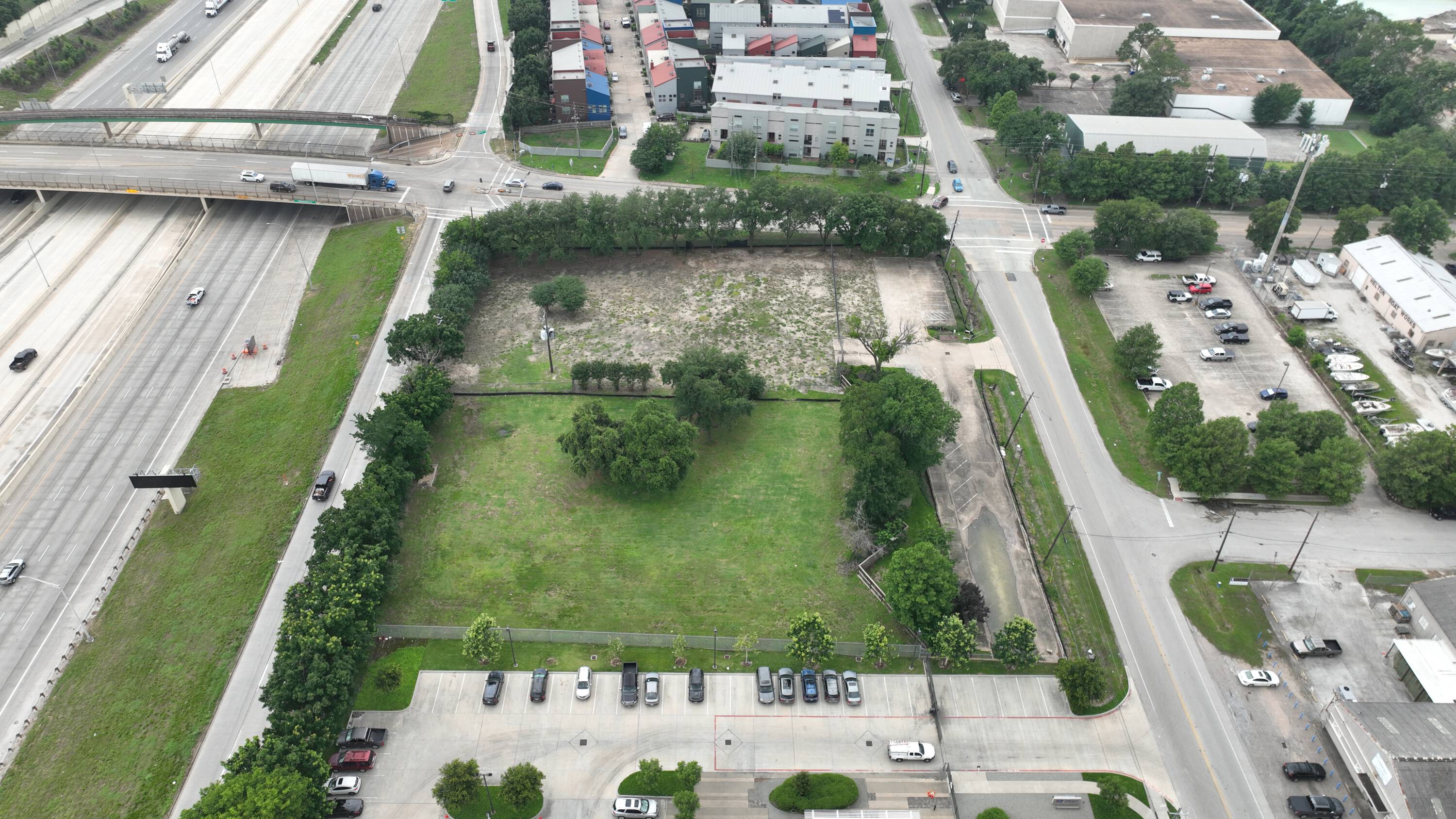 Aerial view of vacant land at 6897 Ardmore St, Houston, TX, ready for development with surrounding industrial and commercial properties.