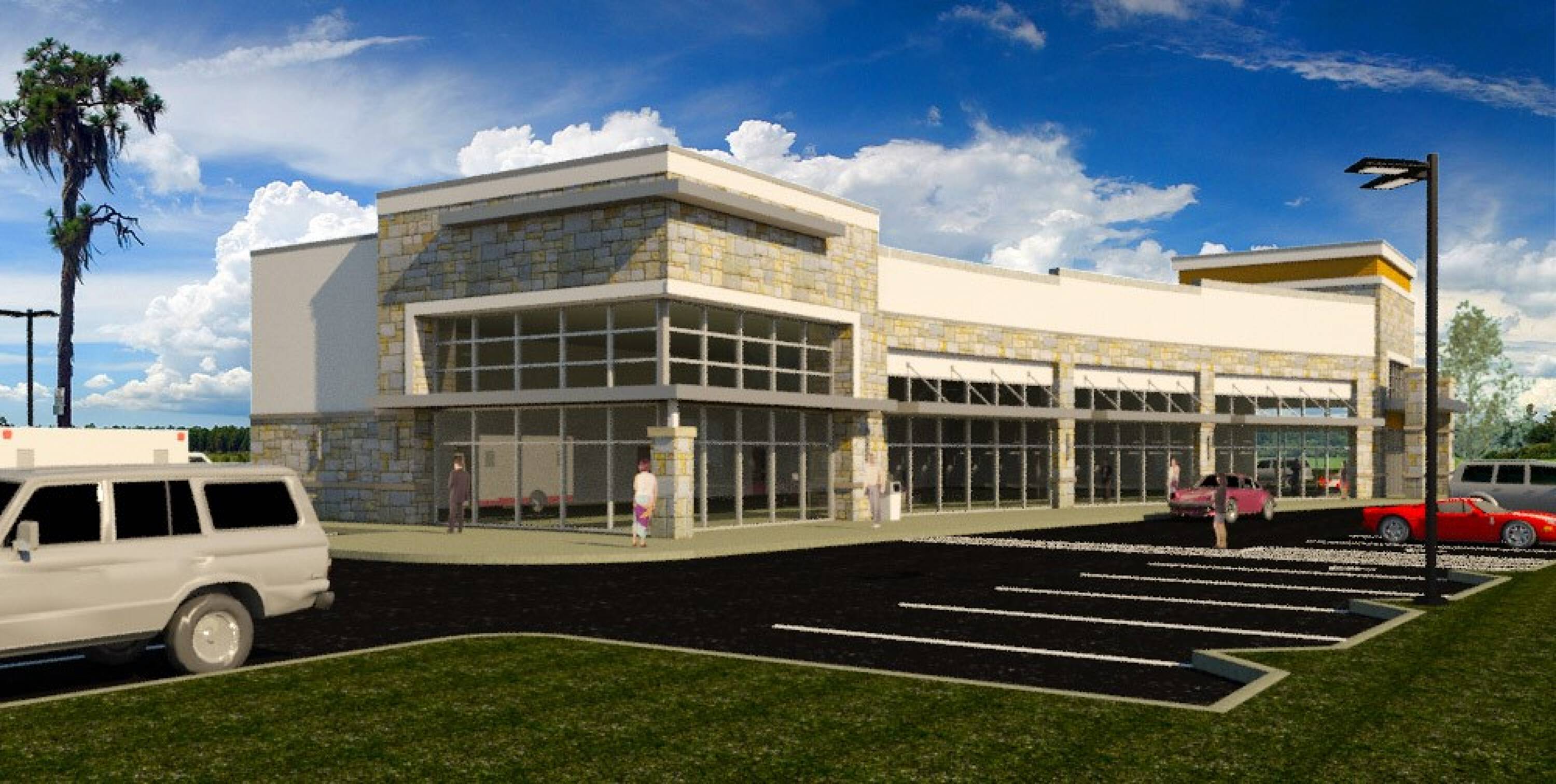 Modern retail development with ample parking and large glass windows in Sinton, TX.