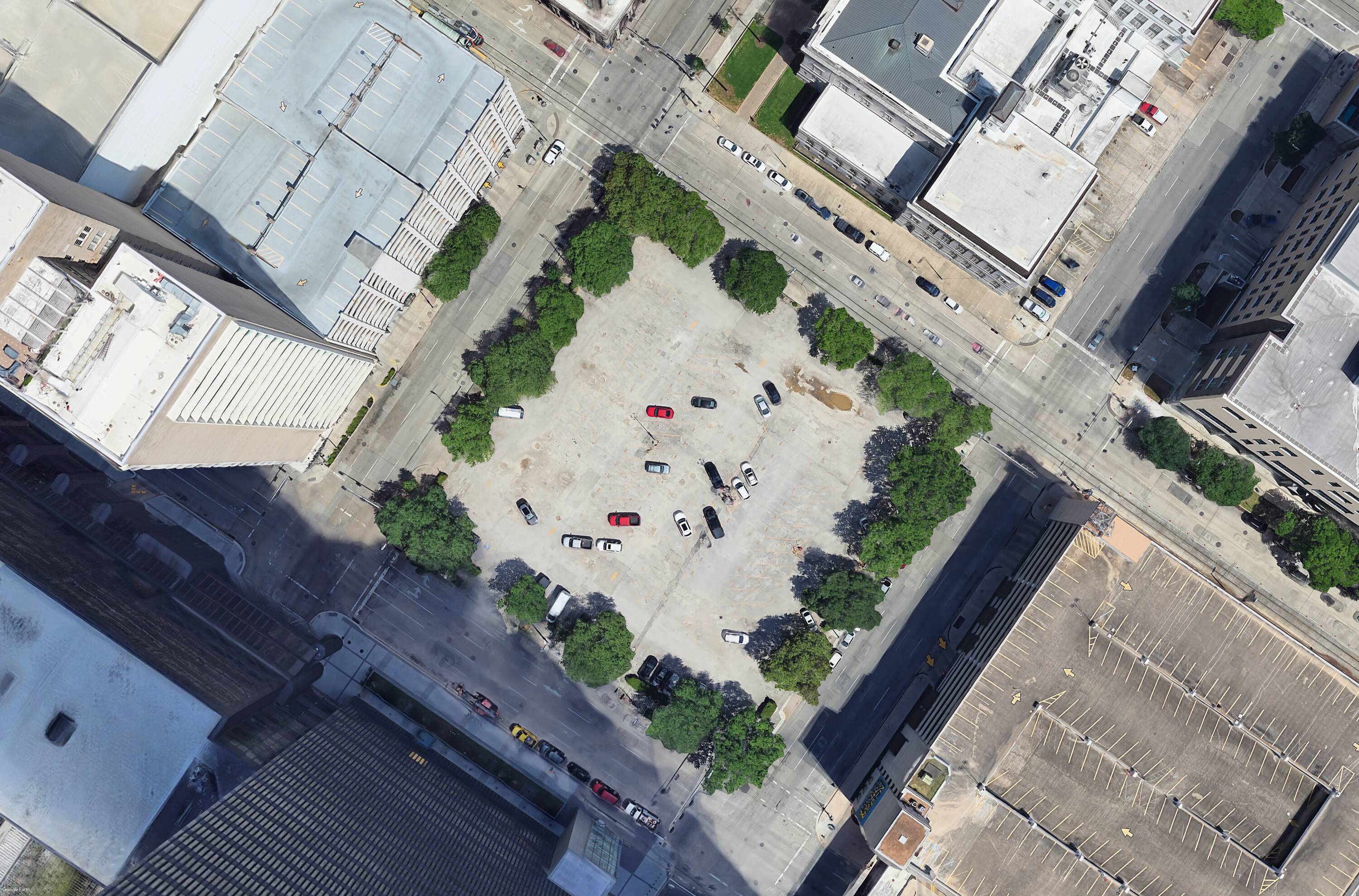 Aerial view of Block 95, a vacant land property at 1215 Walker St, Houston, TX, surrounded by multi-story buildings and parking.