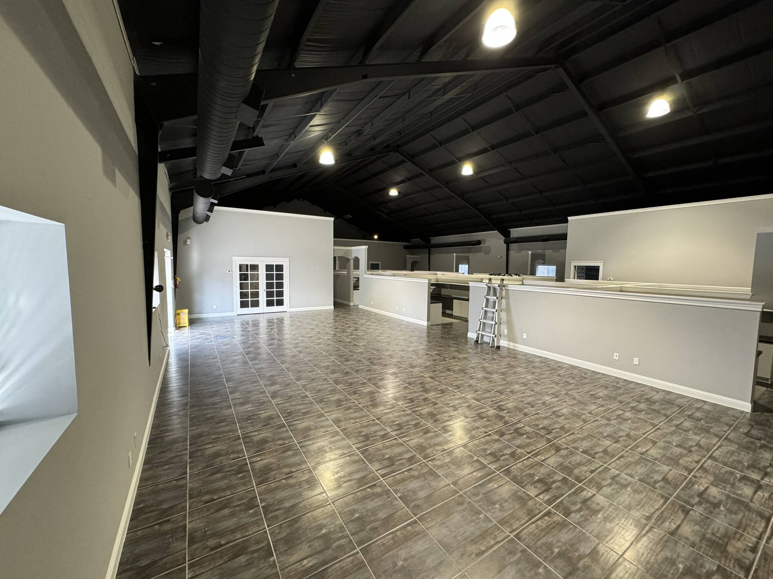 Spacious office warehouse with high ceilings, large windows, and modern lighting at 20020 Hickory Twig Way, Spring, TX.