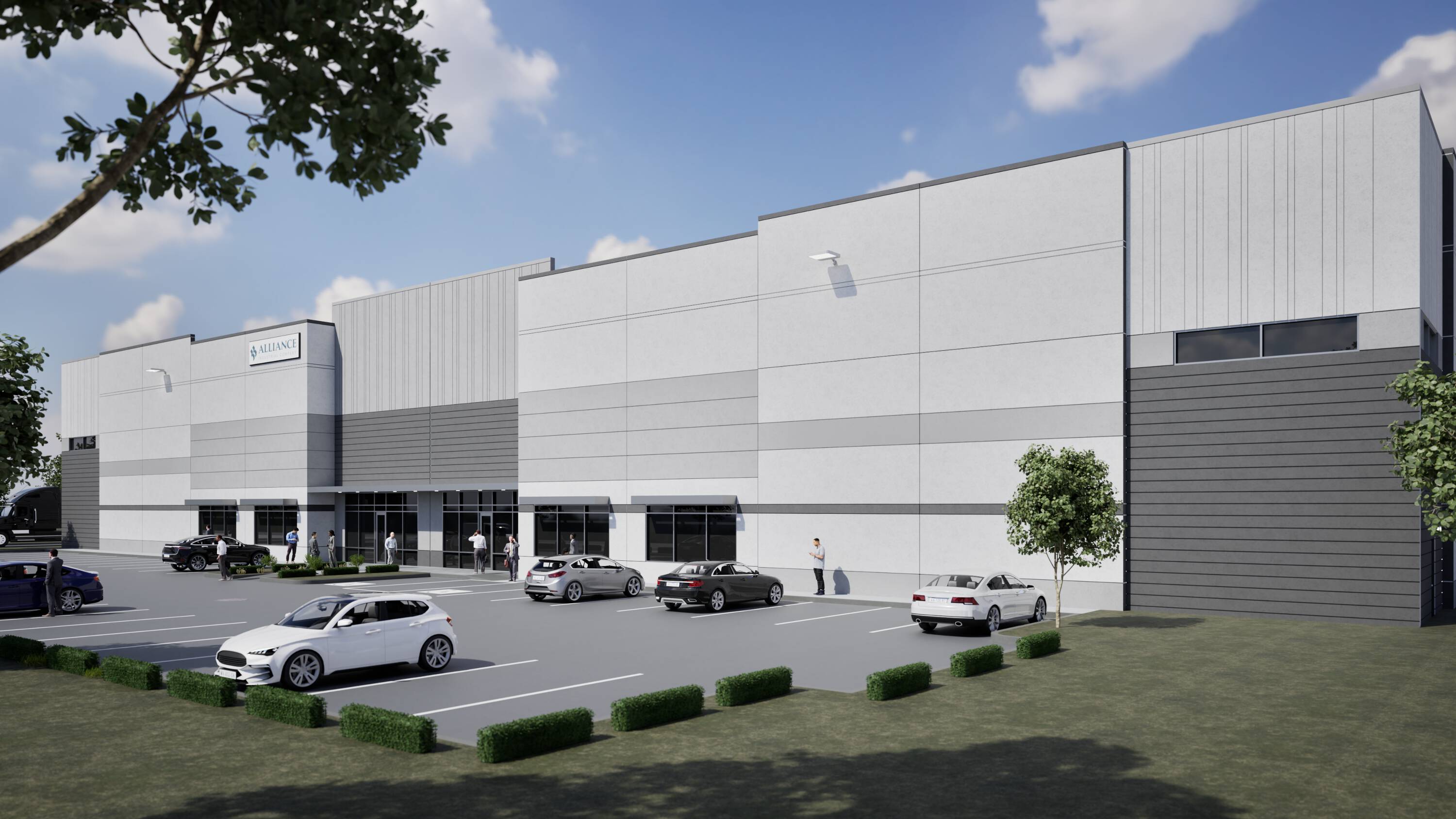 Modern industrial building with ample parking and loading docks at Brookhollow West Industrial Park in Houston, TX.