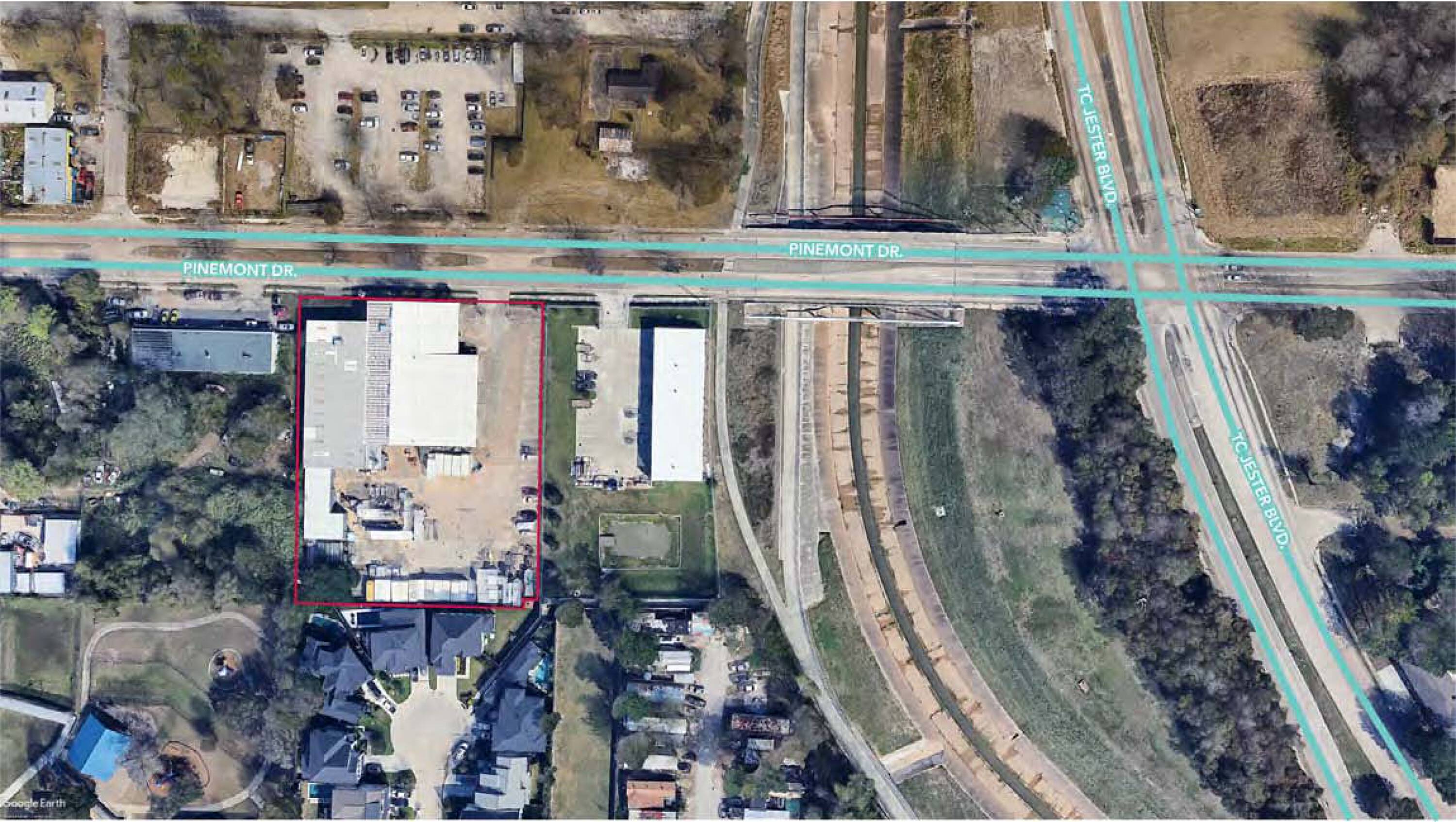Aerial view of 4723 Pinemont Dr, Houston, TX, showing an industrial/office property with ample parking and loading areas.