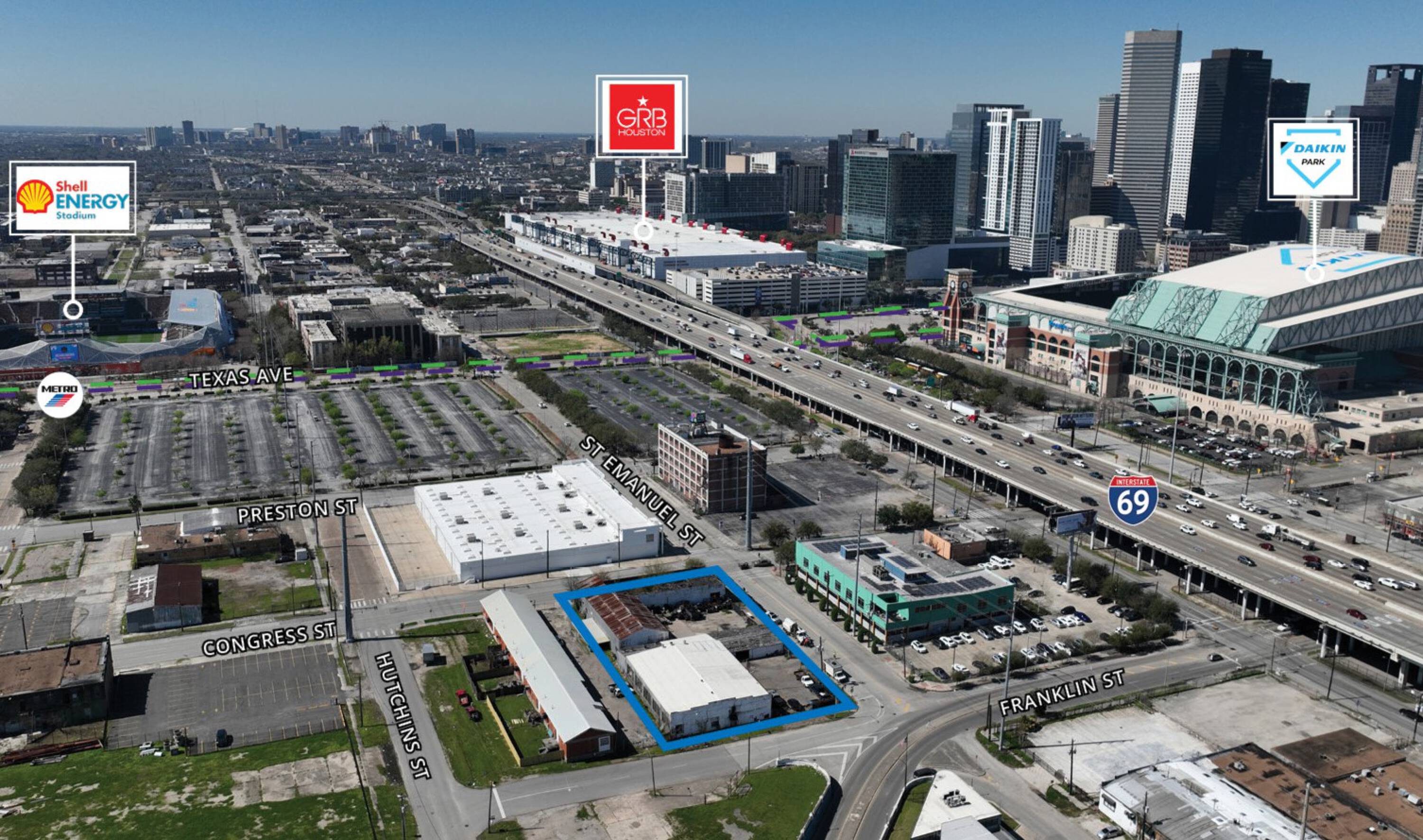 Aerial view of the property at 215 St Emanuel St and 2104 Franklin St in Houston, TX, with surrounding urban development and major highways.