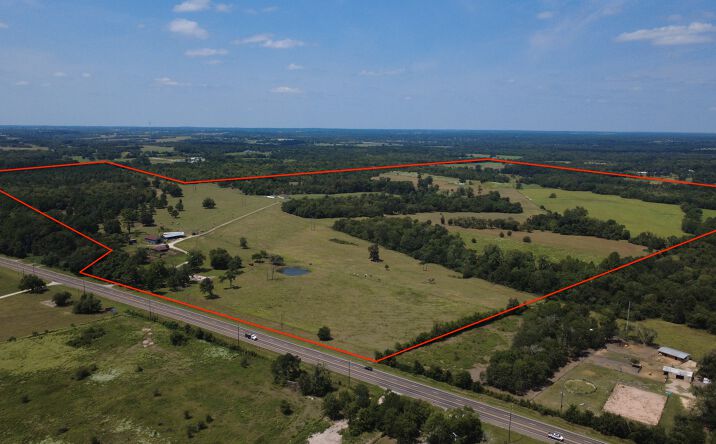 Pictures of Land property located at 18121 TX-105, Plantersville, TX 77363 for sales - image #1