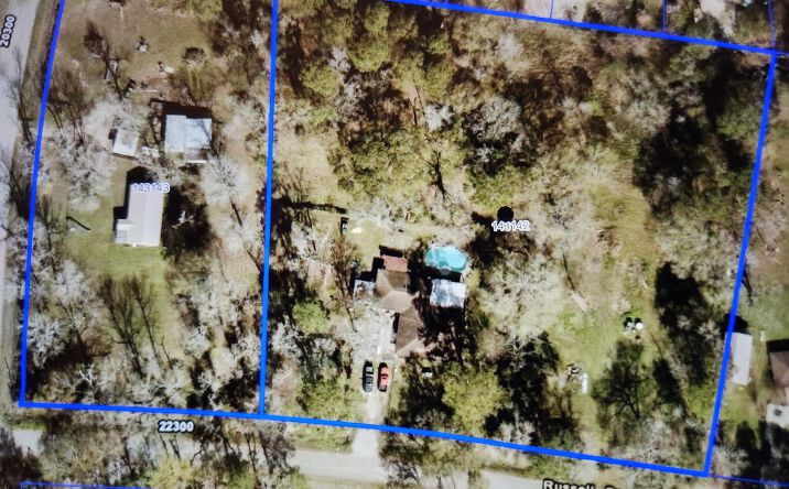 Pictures of Land property located at 20371 Vick Drive & 22401 Russell Dr., New Caney, TX 77357 for sales - image #1