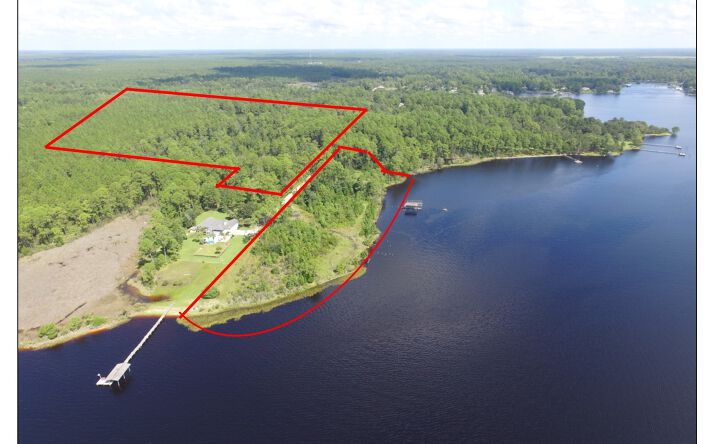 Pictures of Land property located at 6822 Hilliard St, Southport, FL 32409 for sales - image #1