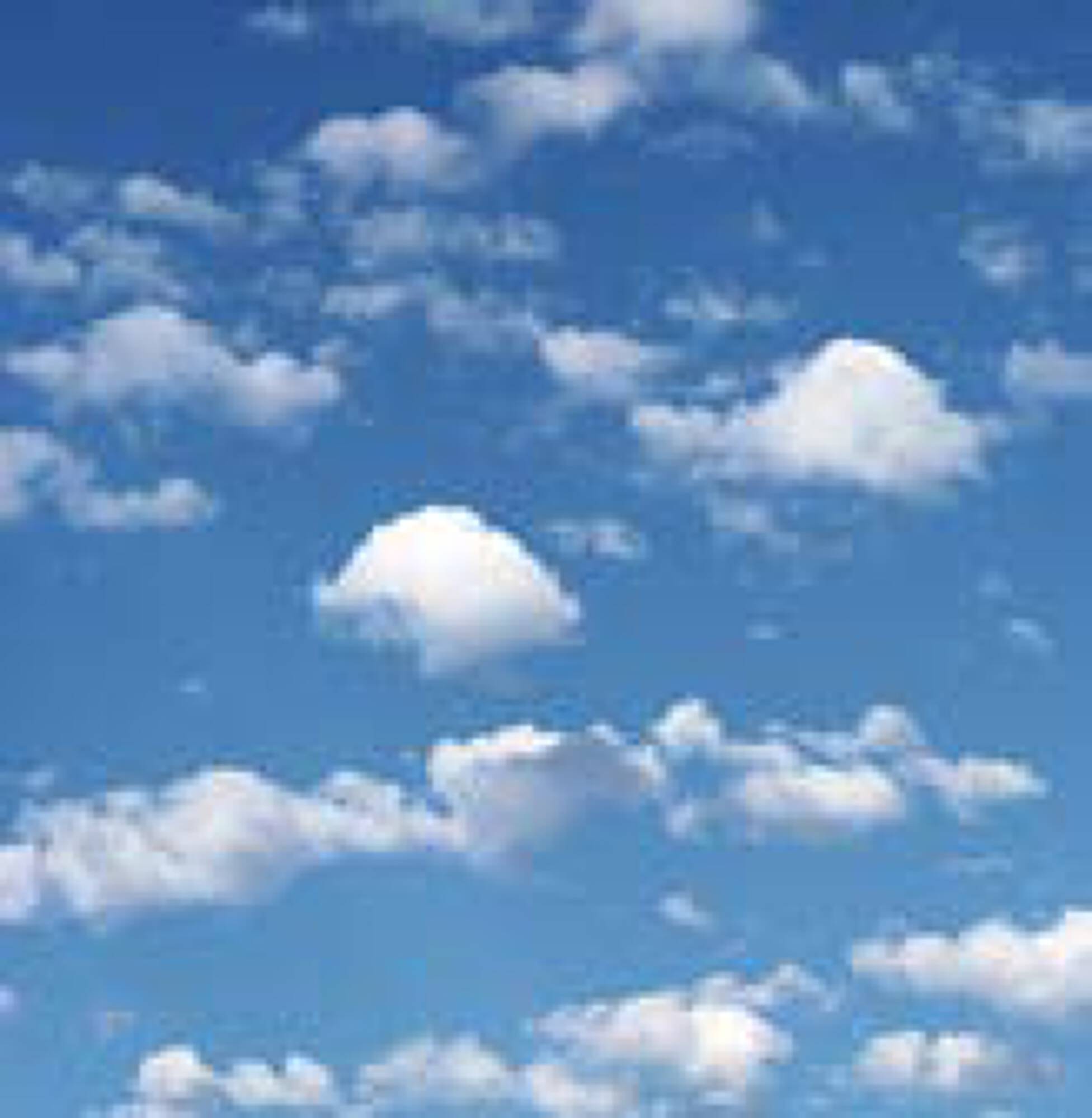 Blue sky with scattered white clouds over the vacant land at 7701 Washington Avenue, Houston, TX.