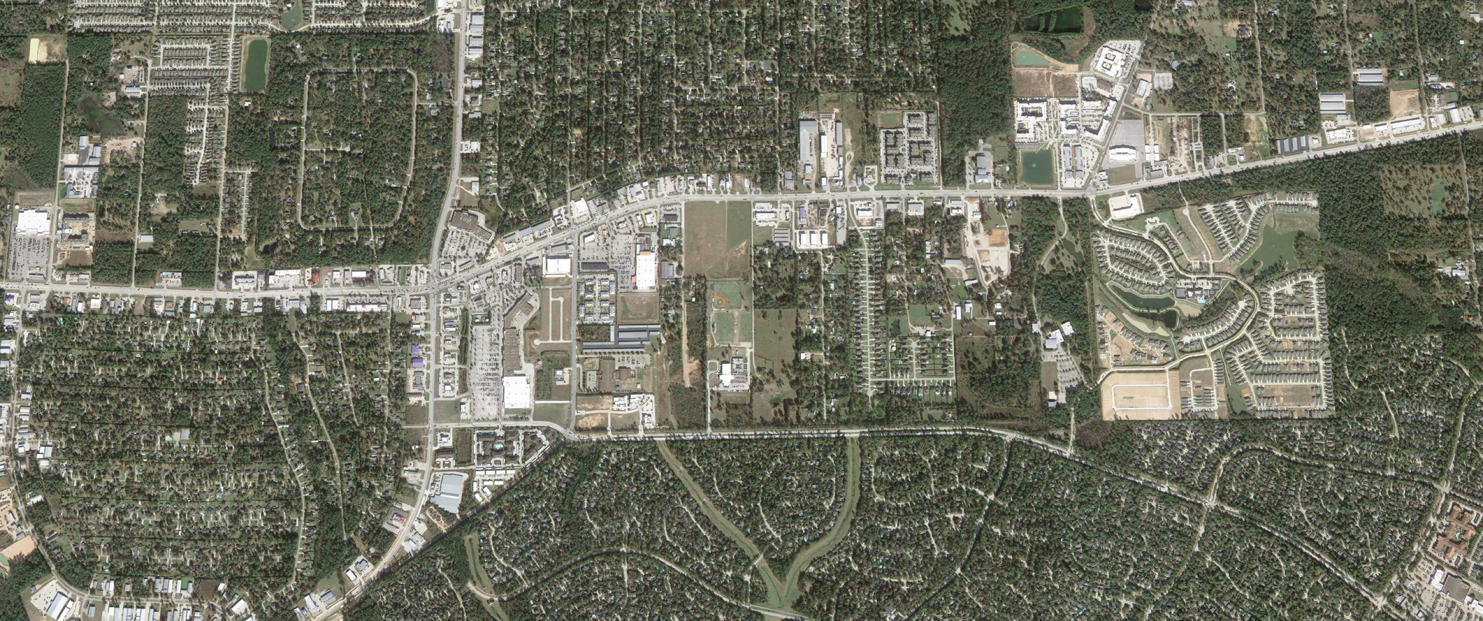 Aerial view of Coe Lane & Research Forest property, a large vacant land parcel in Magnolia, TX.