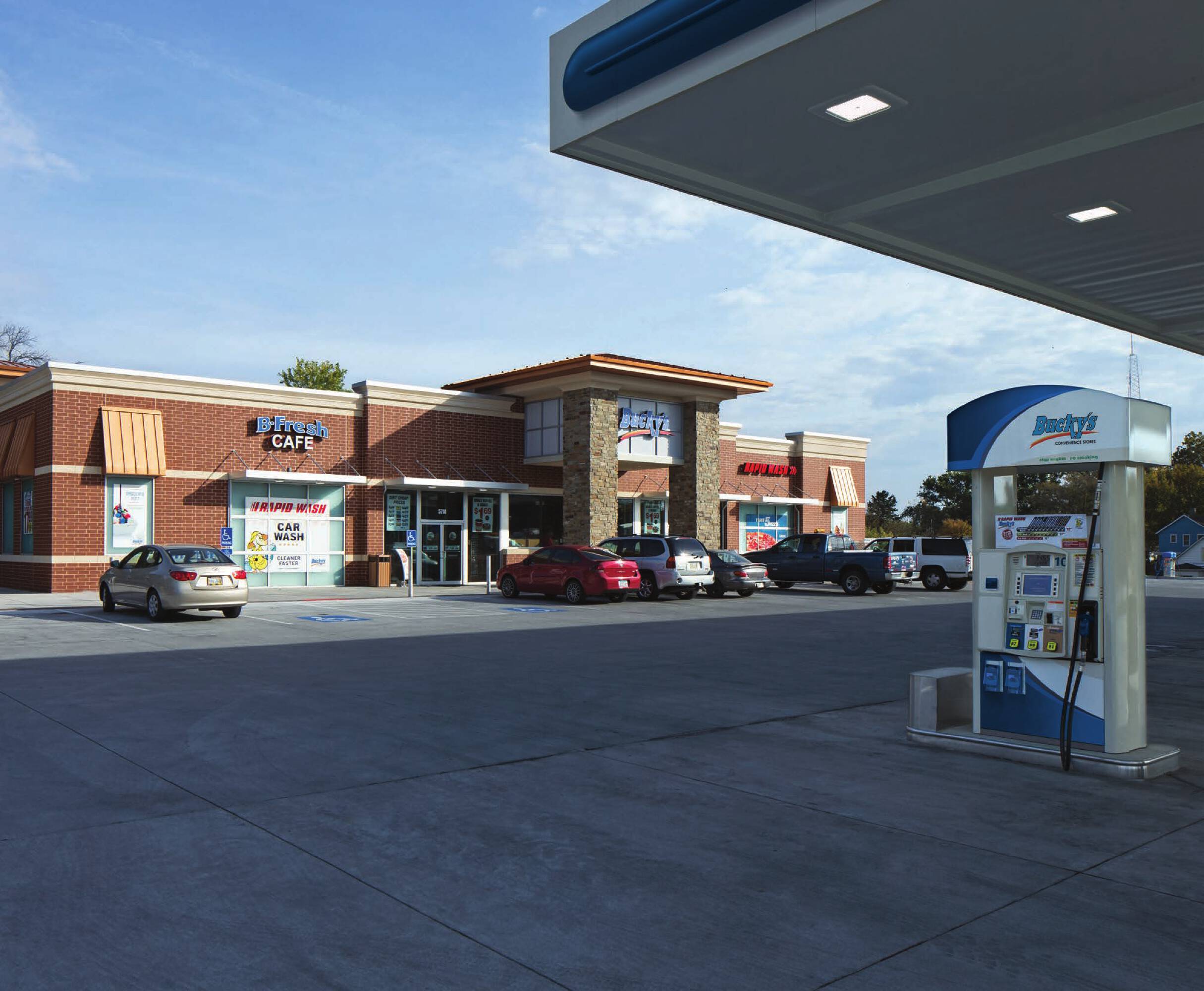 Retail strip center with multiple tenant spaces and a gas station at SWC Clay Road & Gessner Road, Houston, TX.