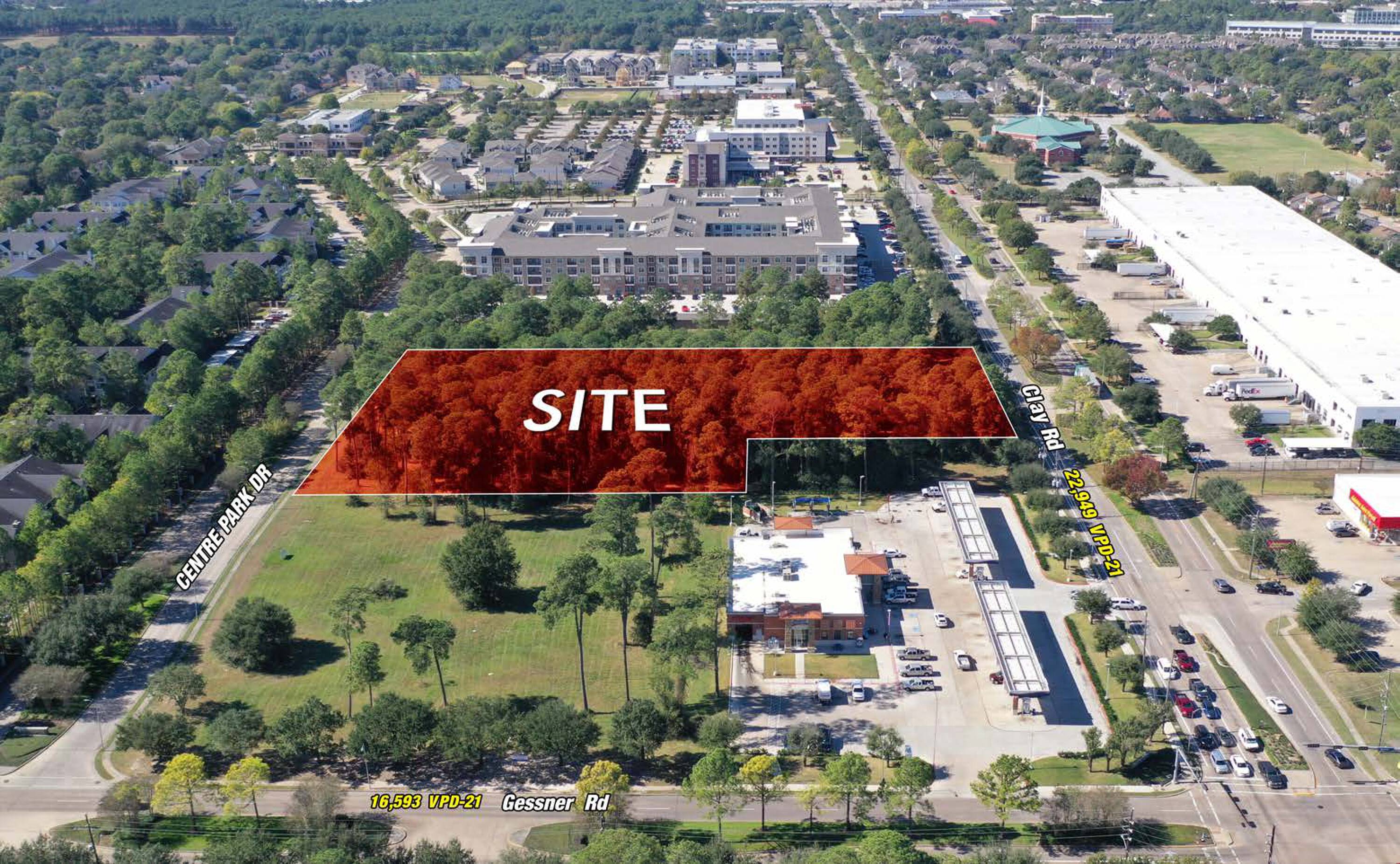 Aerial view of the vacant land at SWC Clay Road & Gessner Road, Houston, TX, with surrounding commercial and residential properties.