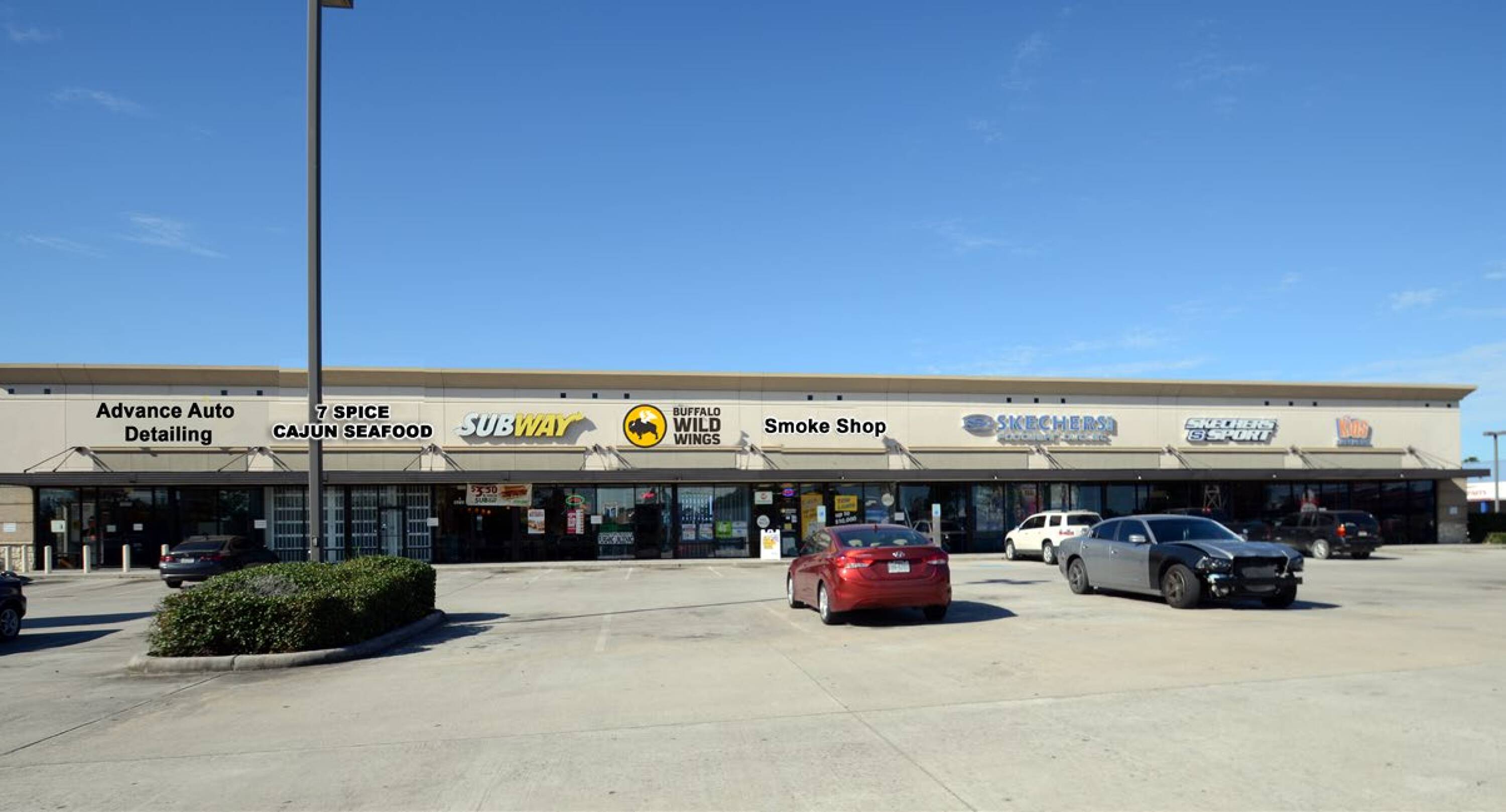 A well-maintained retail strip center with multiple tenants including Advance Auto Detailing, Cajun Seafood, Subway, and Wingstop.