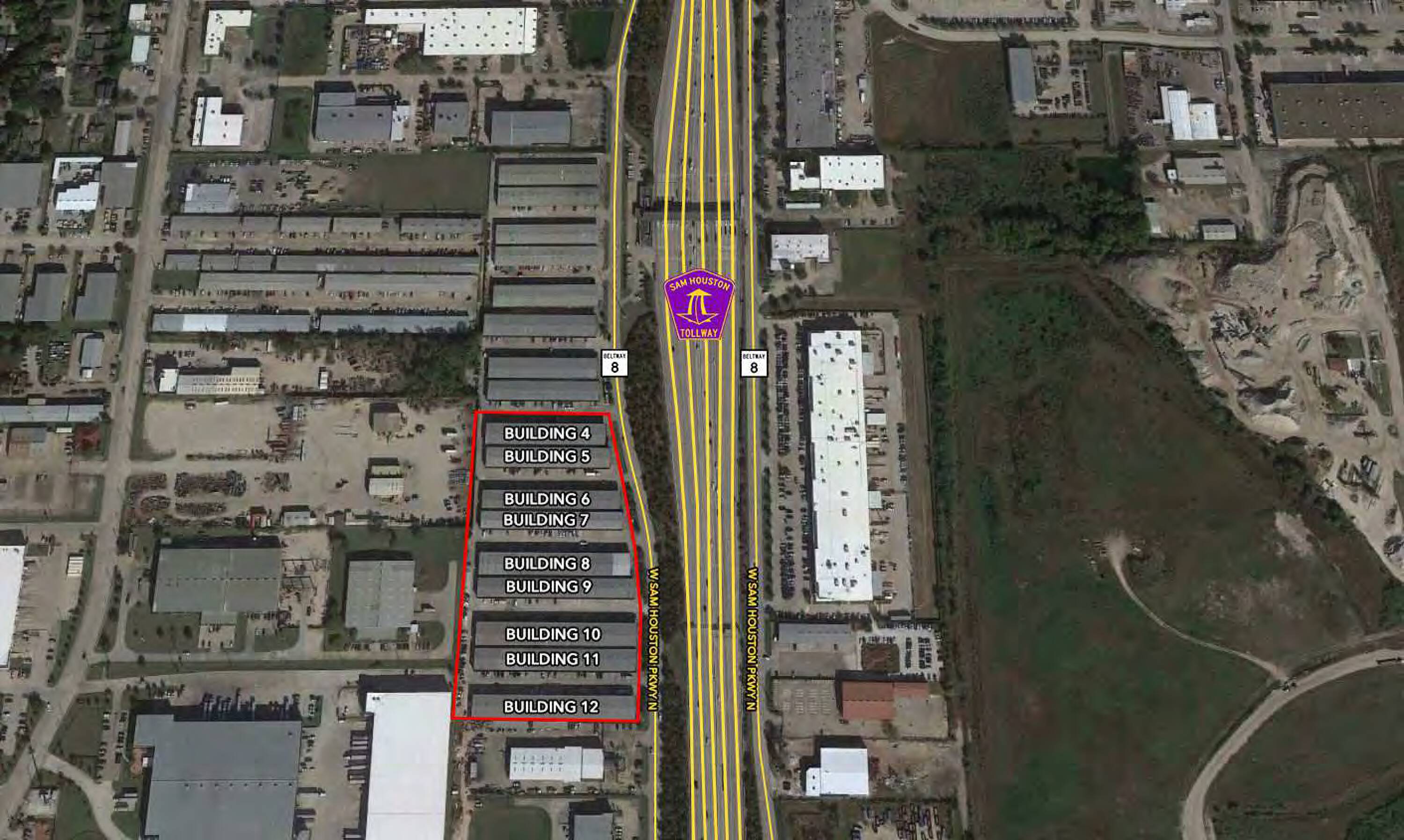 Aerial view of an industrial complex with multiple buildings and direct highway access.