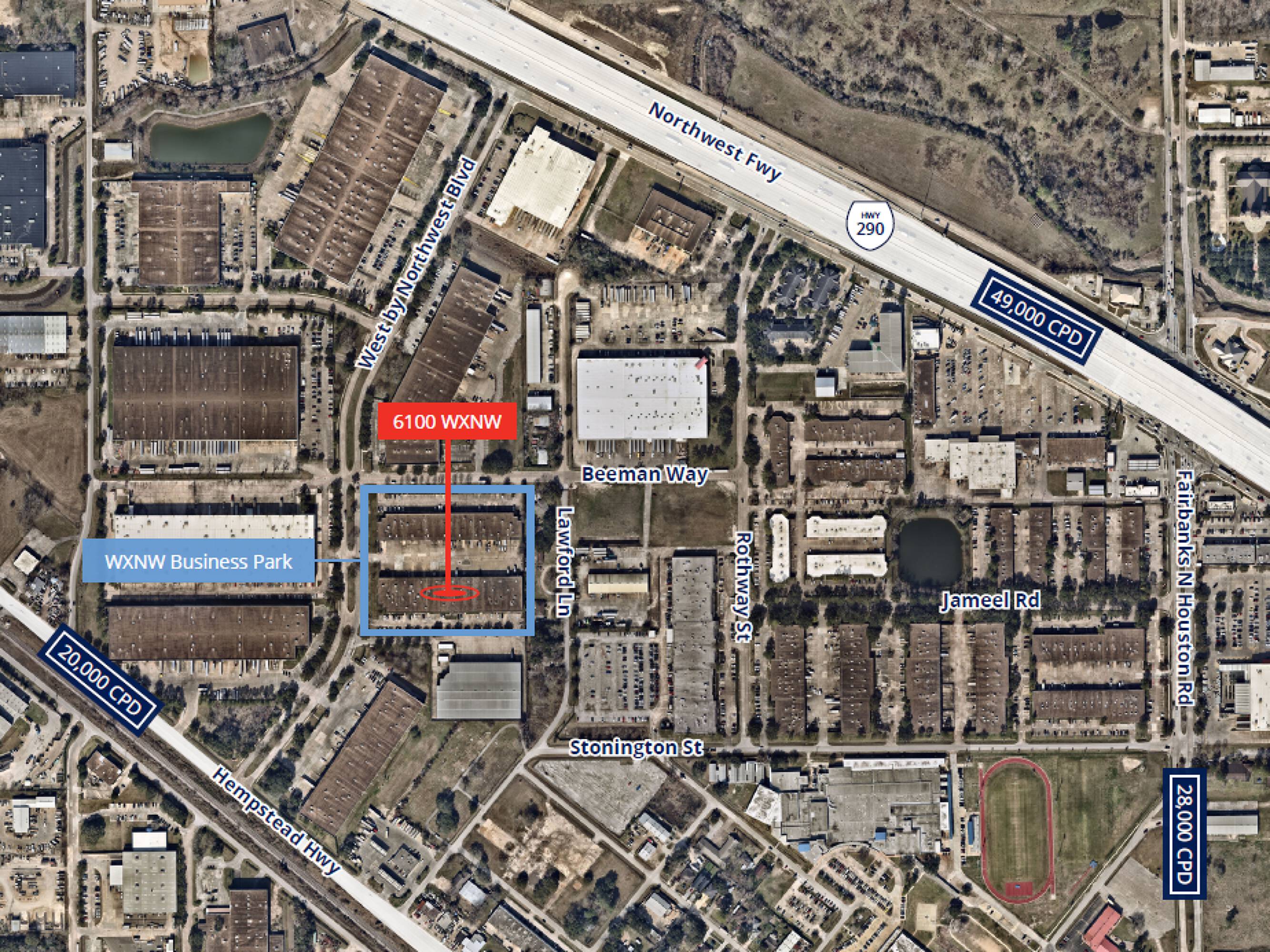 Aerial view of an industrial warehouse complex in WOWN Business Park with surrounding amenities and highways.