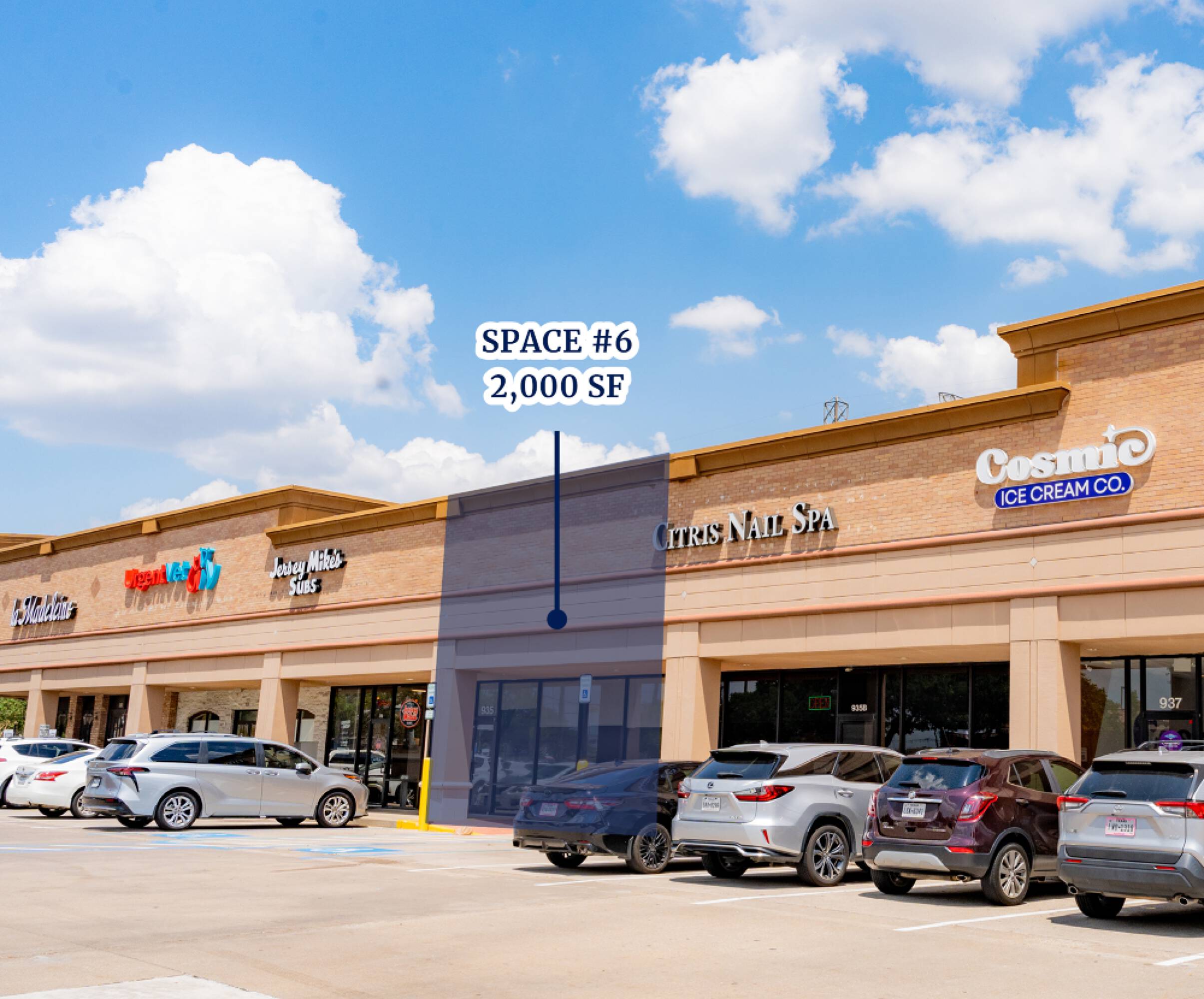 A well-maintained retail strip center with prominent signage for Cosmic Ice Cream Co., Citrus Nail Spa, Laundry King, and Pizza Hut, featuring ample parking and natural light.