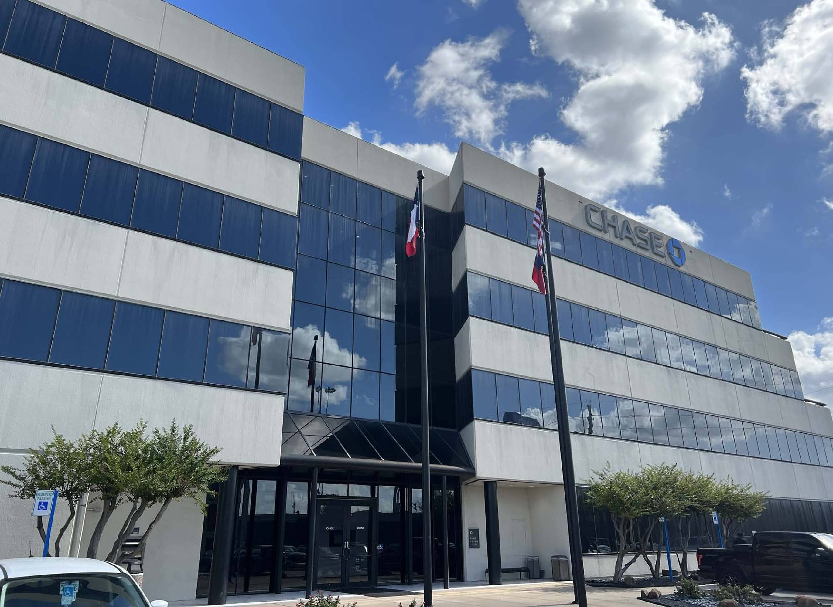 Chase Bank Office Building with a modern facade, extensive glass windows, and well-maintained landscaping in Humble, TX.