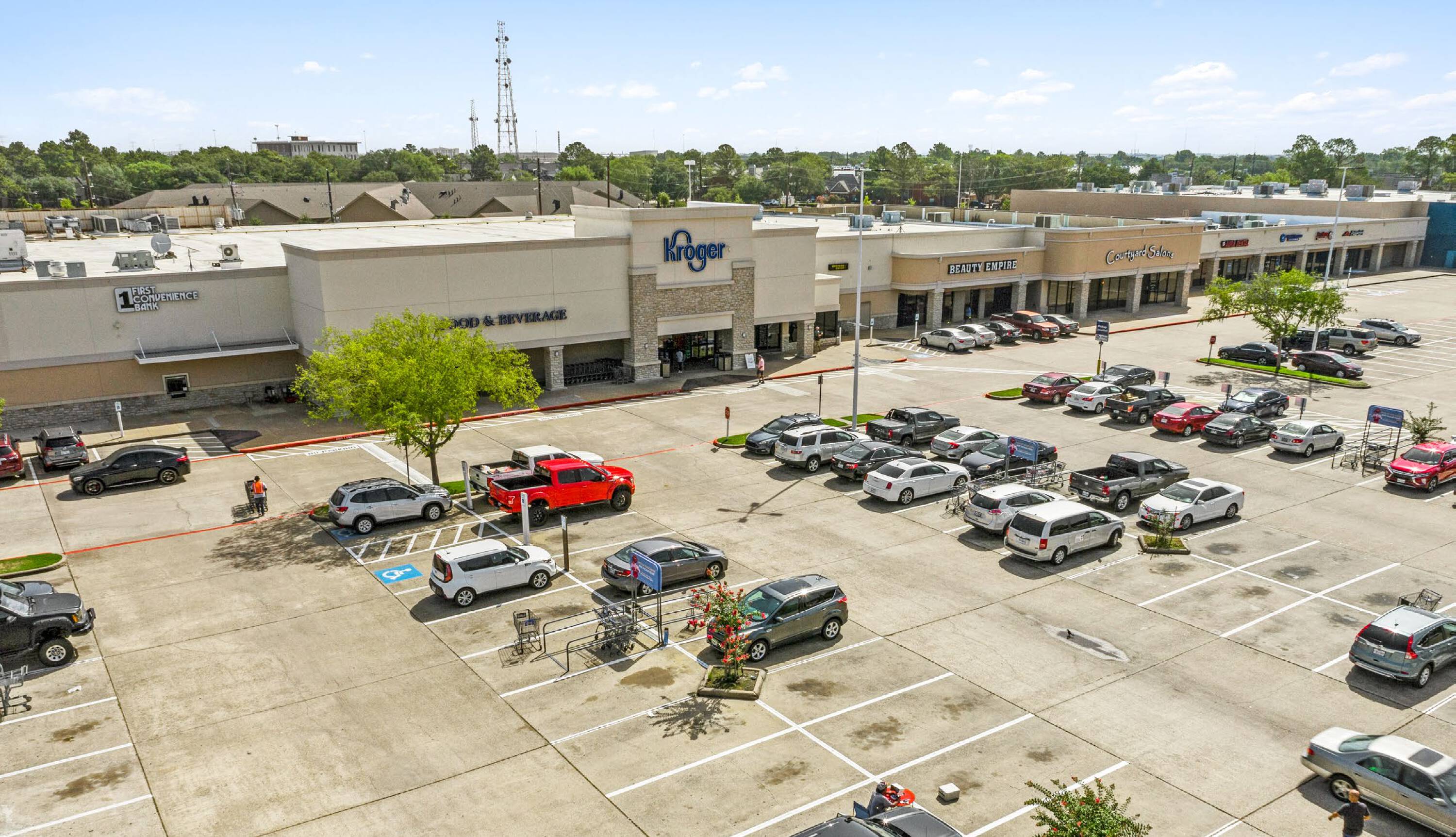 Aerial view of Easton Commons Plaza, a retail strip mall with ample parking and prominent signage for Kroger.