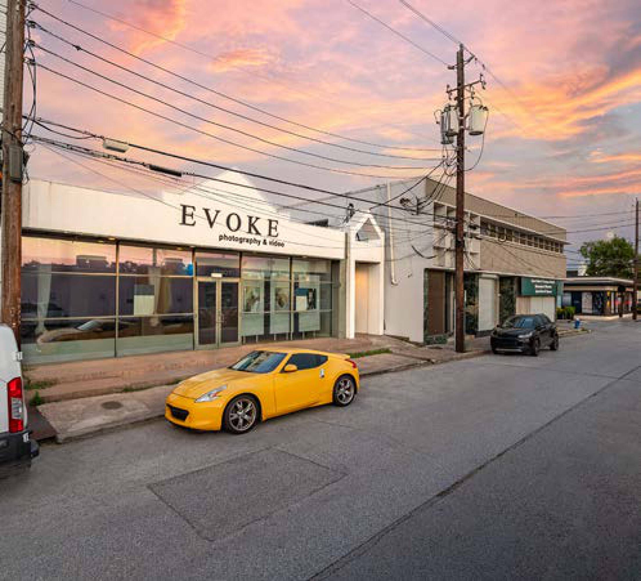 A modern retail and office building with large windows and street parking at 5407 Kelvin Dr, Houston, TX.