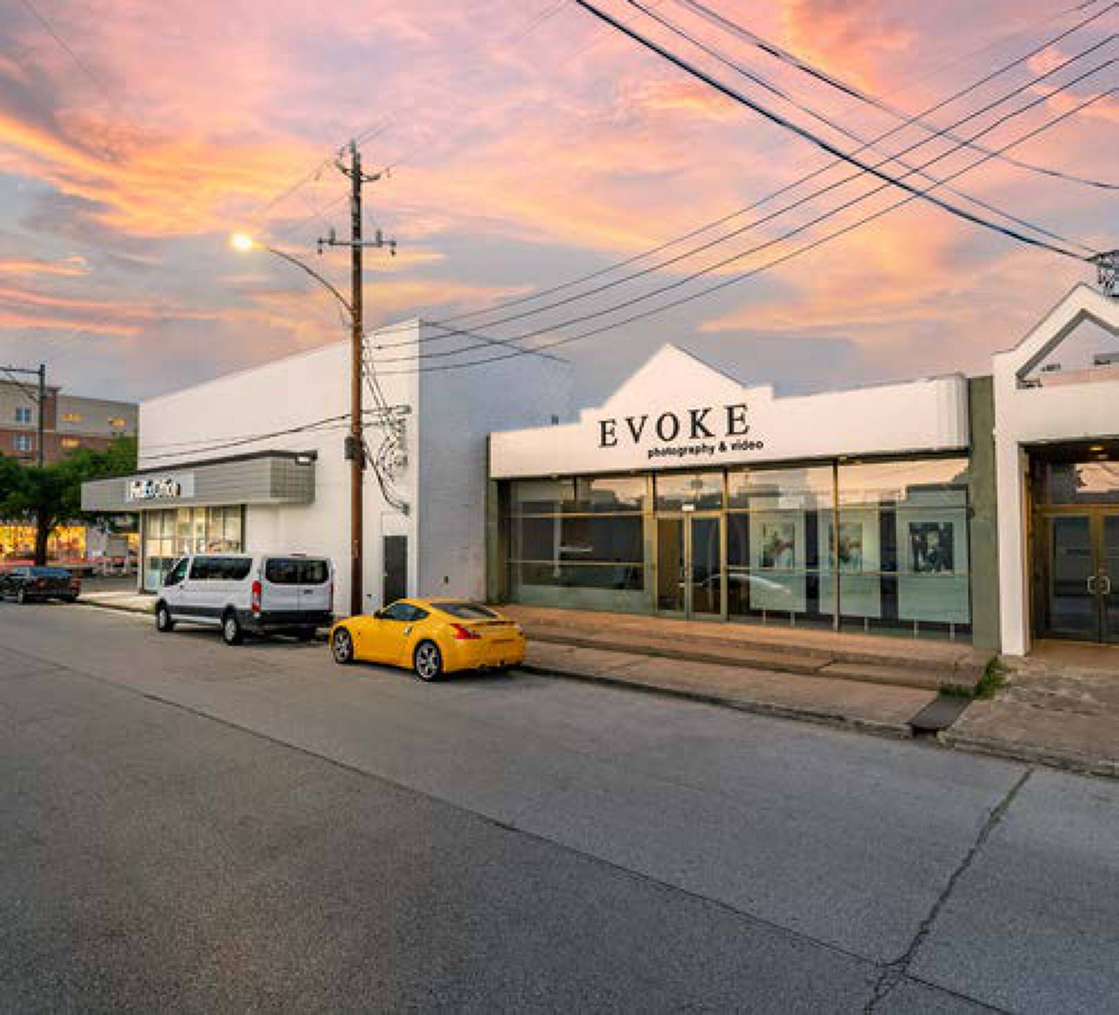 Modern retail and office building at 5407 Kelvin Dr, Houston, TX with large windows and street parking.