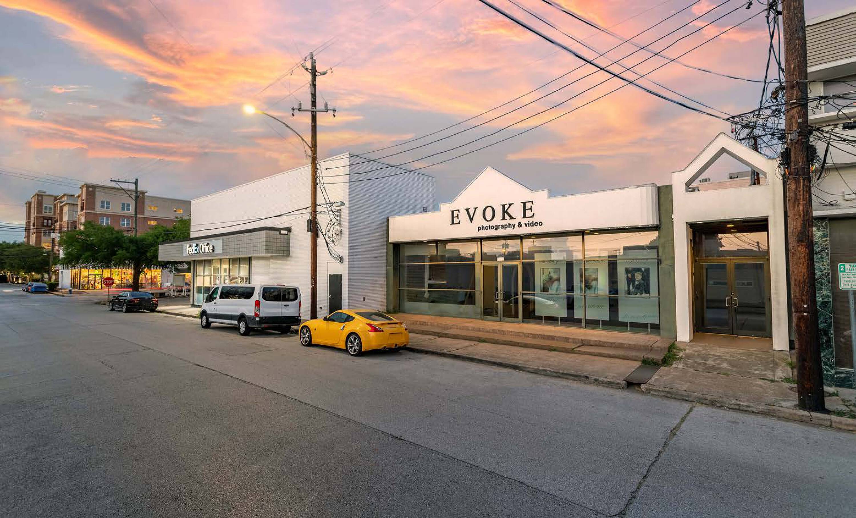 Street view of 5407 Kelvin Dr, Houston, TX, showcasing a modern retail and office space with large windows and street parking.