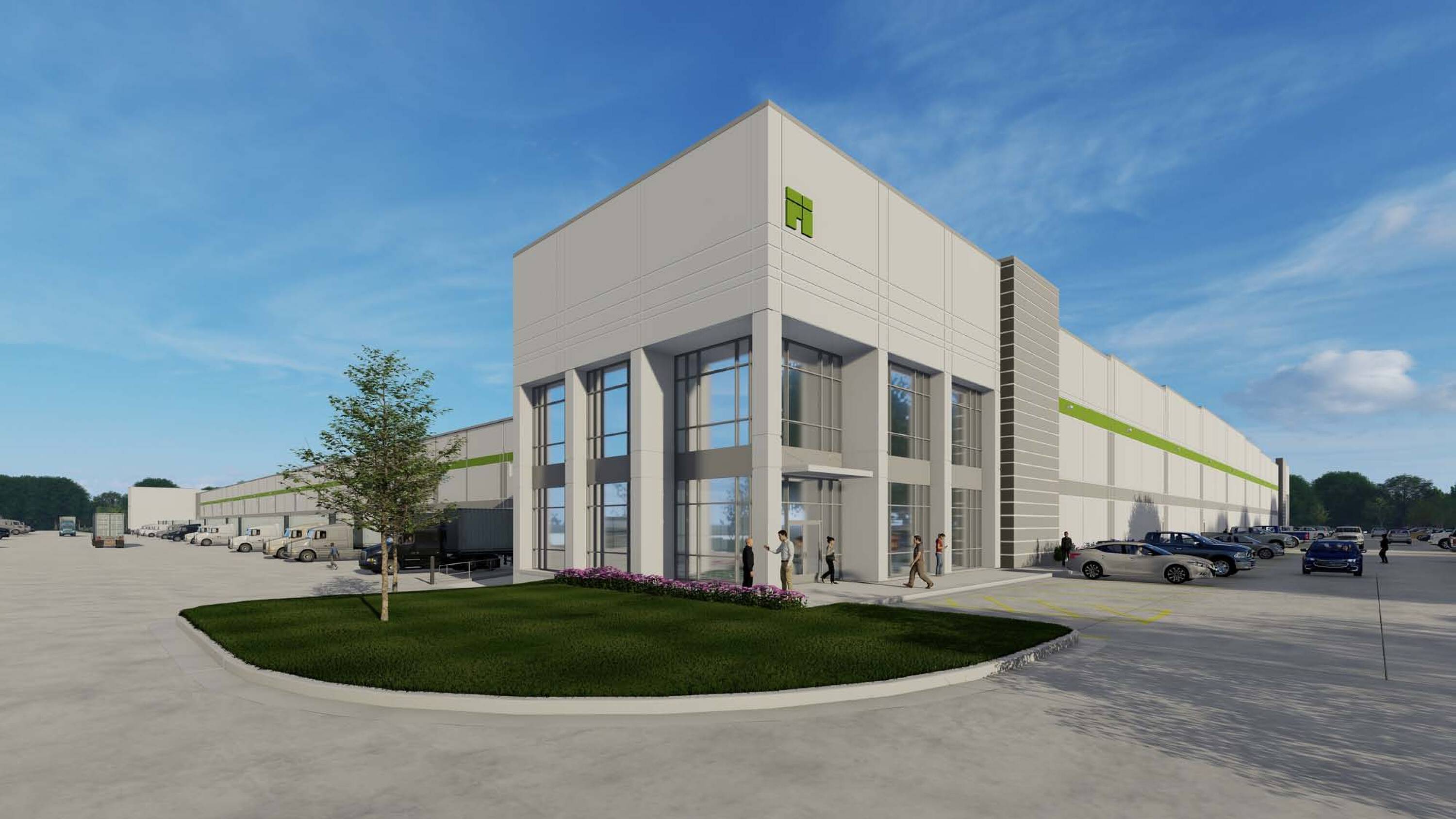 Modern industrial building with large glass entrance, loading docks, and surface parking at First Liberty Logistics Center.