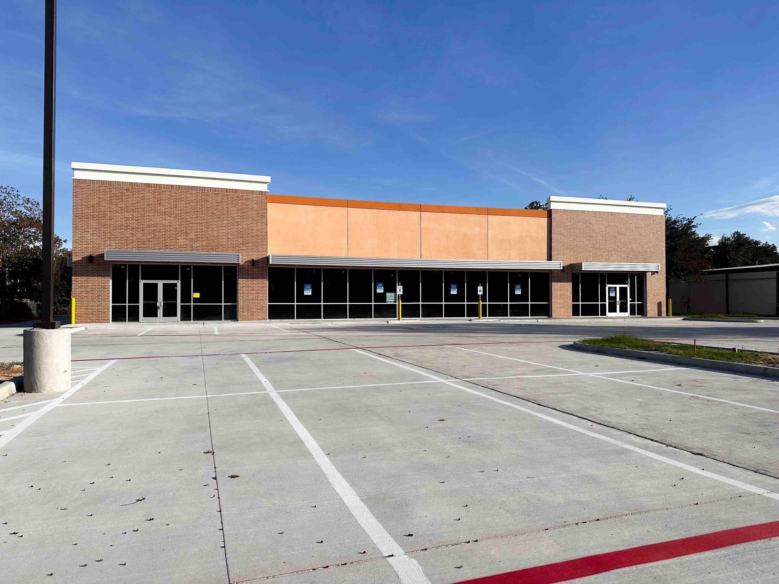 The Shoppes at Riata Heights retail property with brick facade and large windows on Barker Cypress Rd, Cypress, TX.
