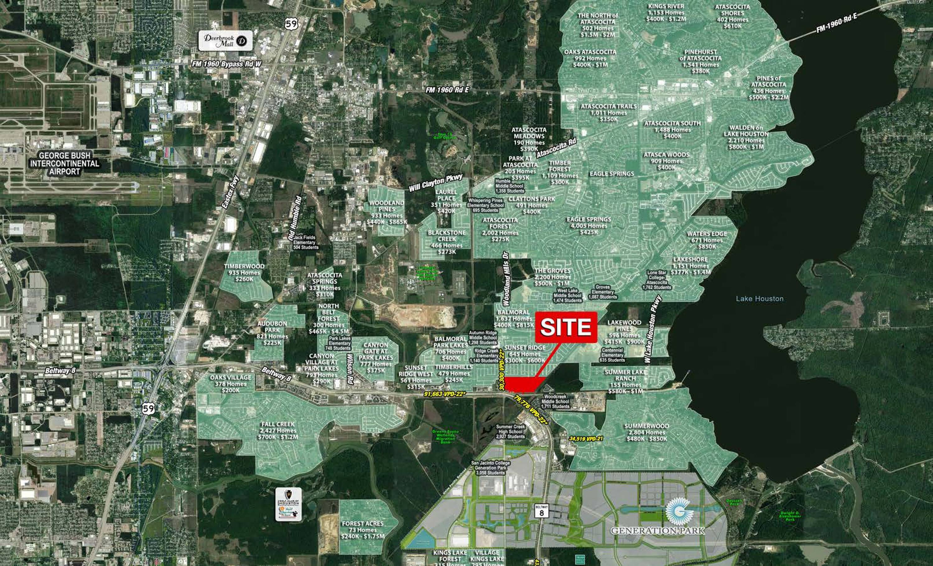 Aerial view of The Bend property located at Beltway 8 & Woodland Hills Dr in Humble, TX, highlighting its commercial surroundings.