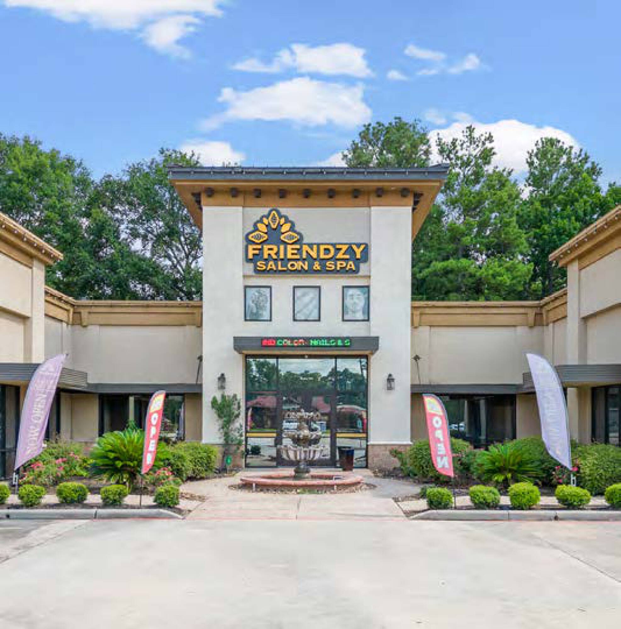 Tuscan Village Plaza at 7214 FM 1488, Magnolia, TX, featuring retail spaces with a central fountain and ample parking.