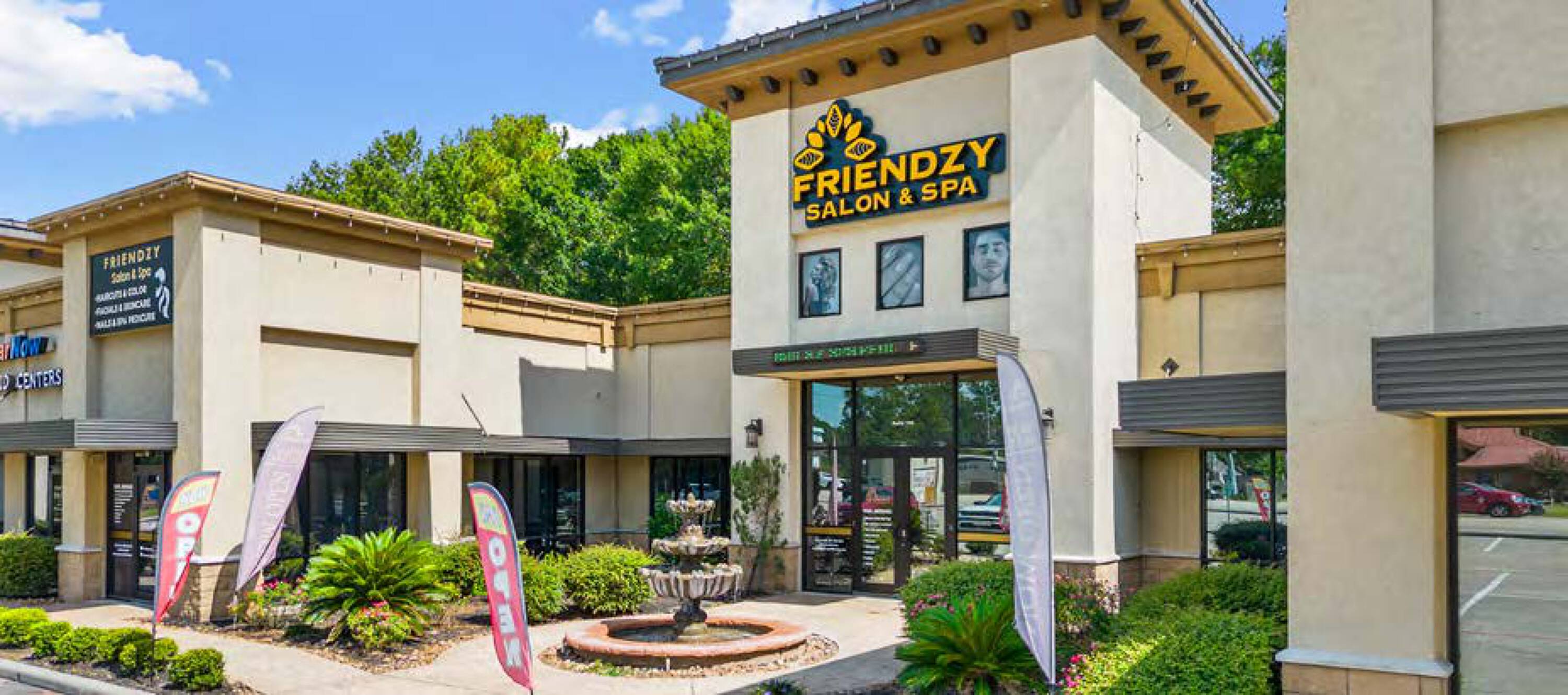Tuscan Village Plaza retail space with stucco exterior, large windows, and a decorative fountain in front.