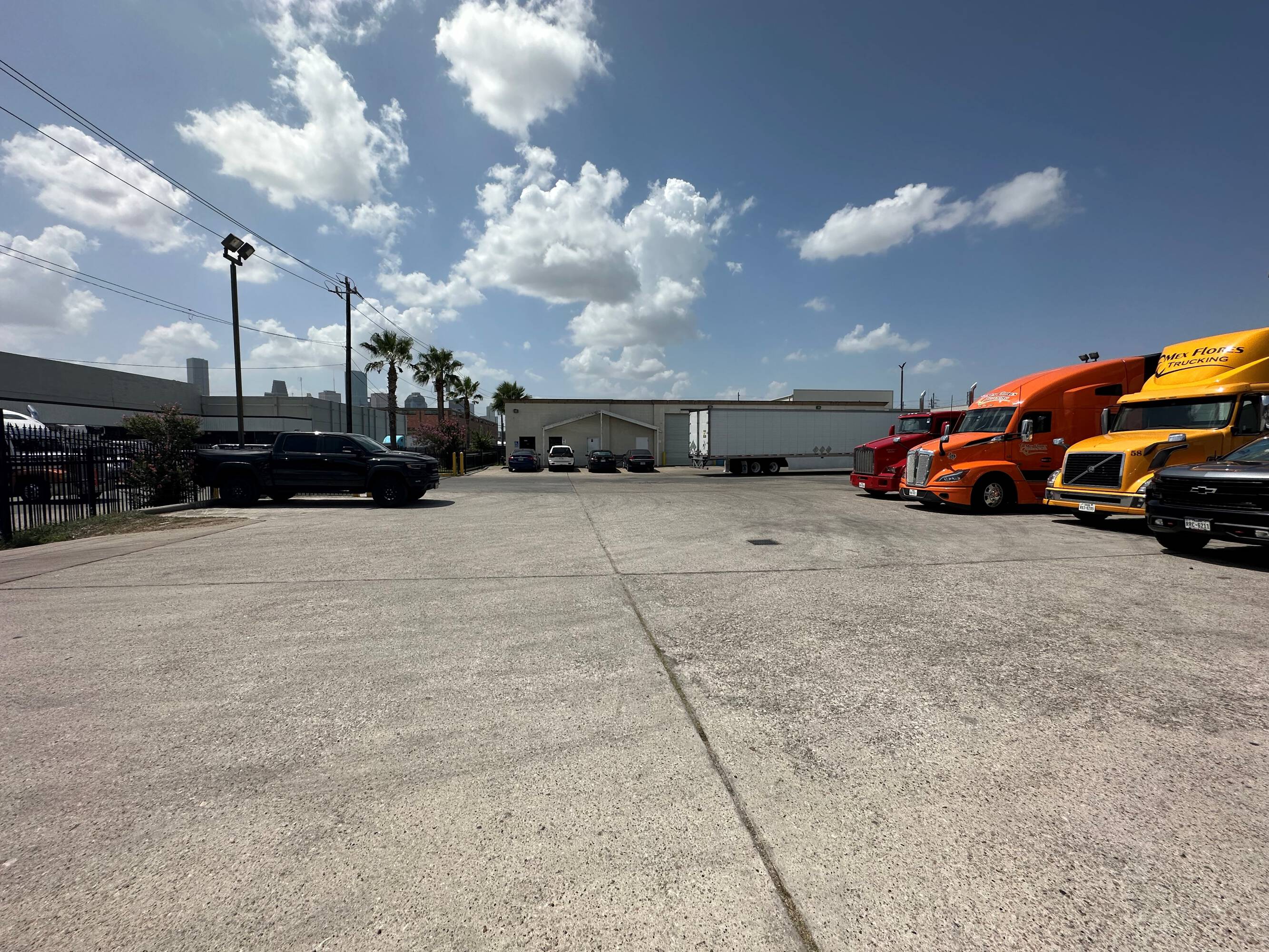 Large industrial lot with multiple trucks and loading docks at 2216 Silver Street, Houston, TX.