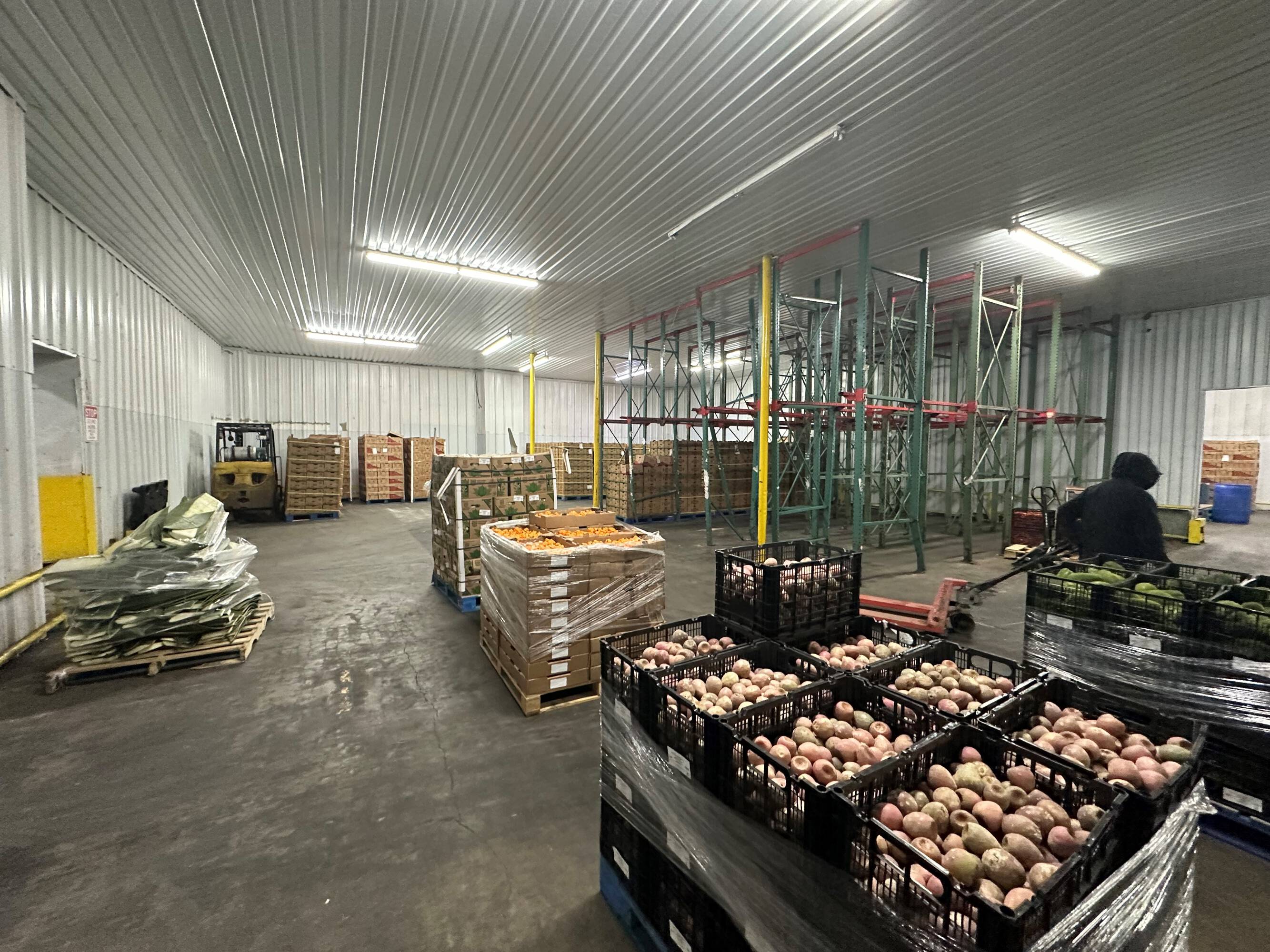 Interior of an industrial warehouse with high ceilings, organized storage, and ample lighting at 2216 Silver Street, Houston, TX.