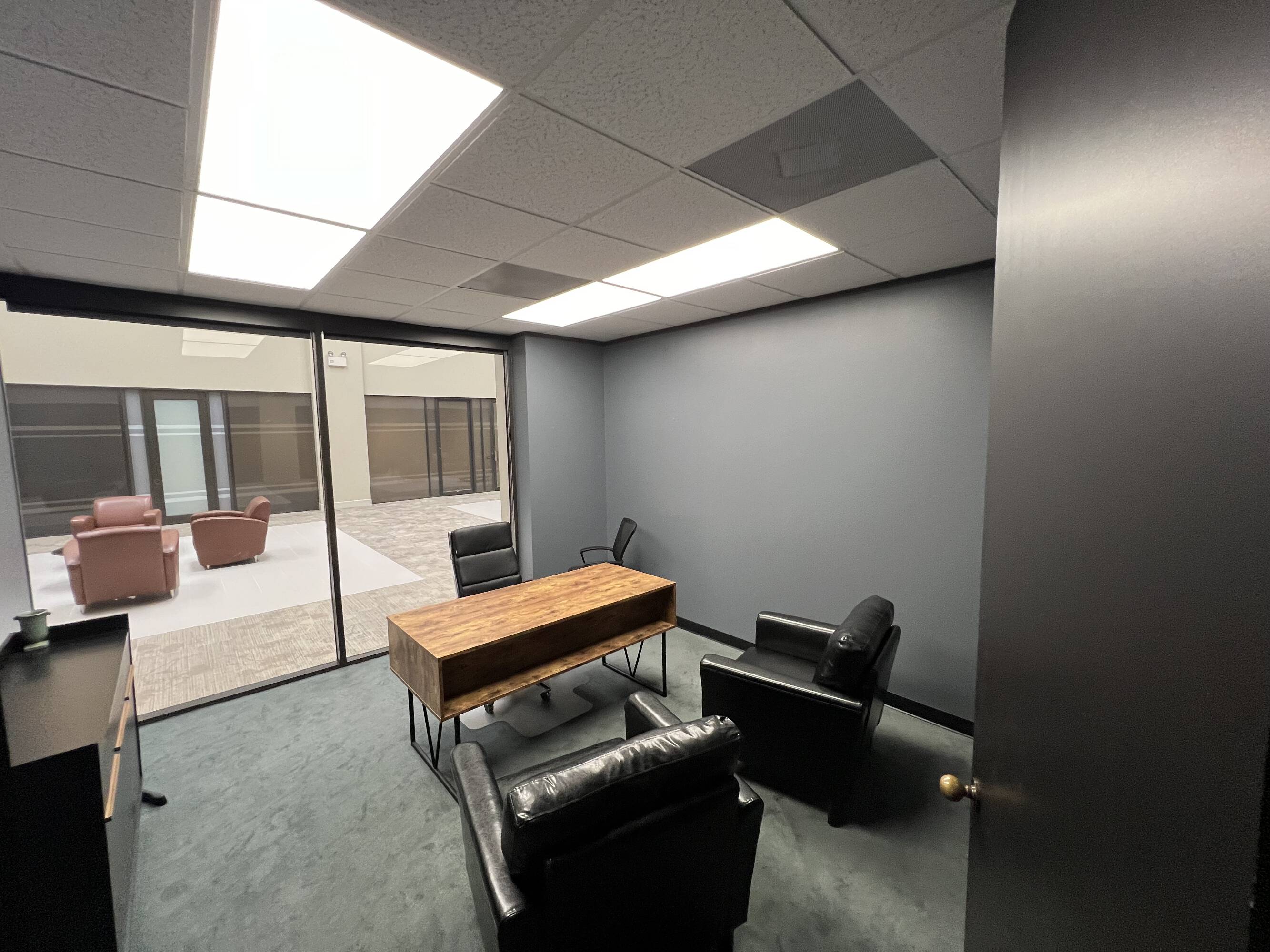 Modern office space with large windows, natural light, and contemporary furnishings at Law Office of Sean Buckley in Houston, TX.
