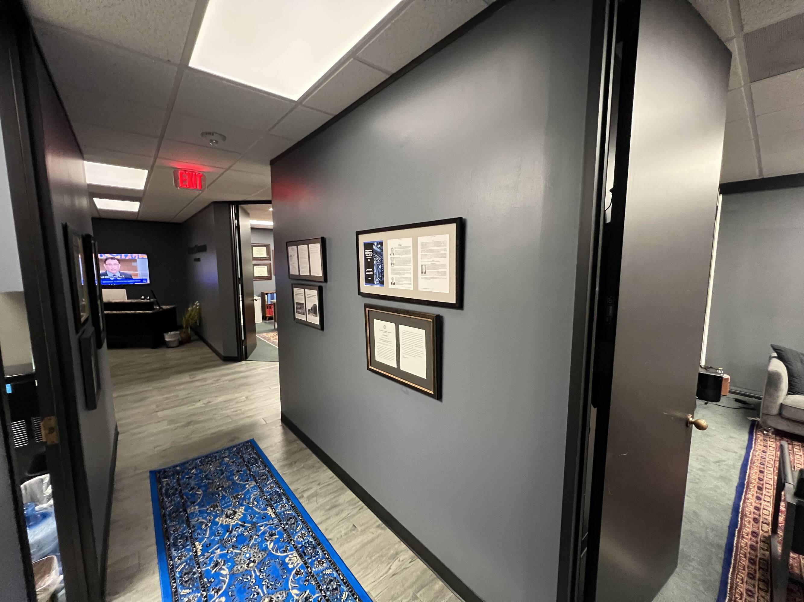 Interior hallway of the Law Office of Sean Buckley at Woodway Center, Suite 300W, featuring modern decor and ample natural light.