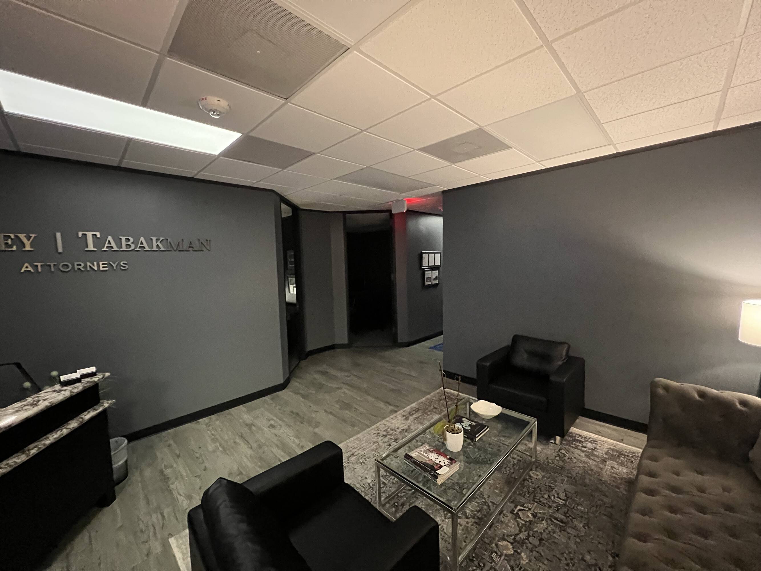 Reception area of the Law Office of Sean Buckley at Woodway Center with modern seating and professional signage.