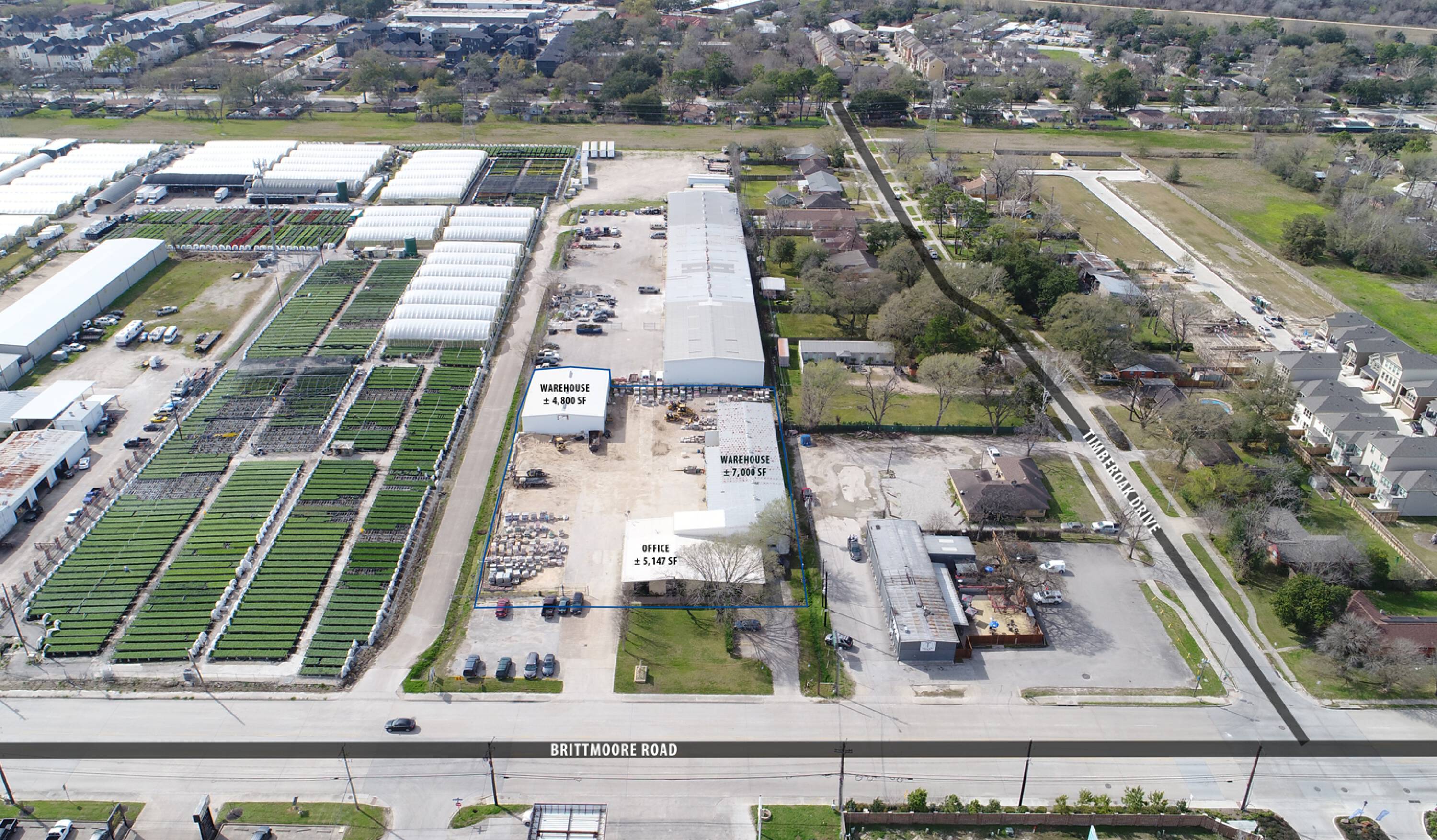 Aerial view of Brittmoore Business Park at 1505 Brittmoore Rd, Houston, TX, showing industrial buildings, greenhouses, and surrounding area.