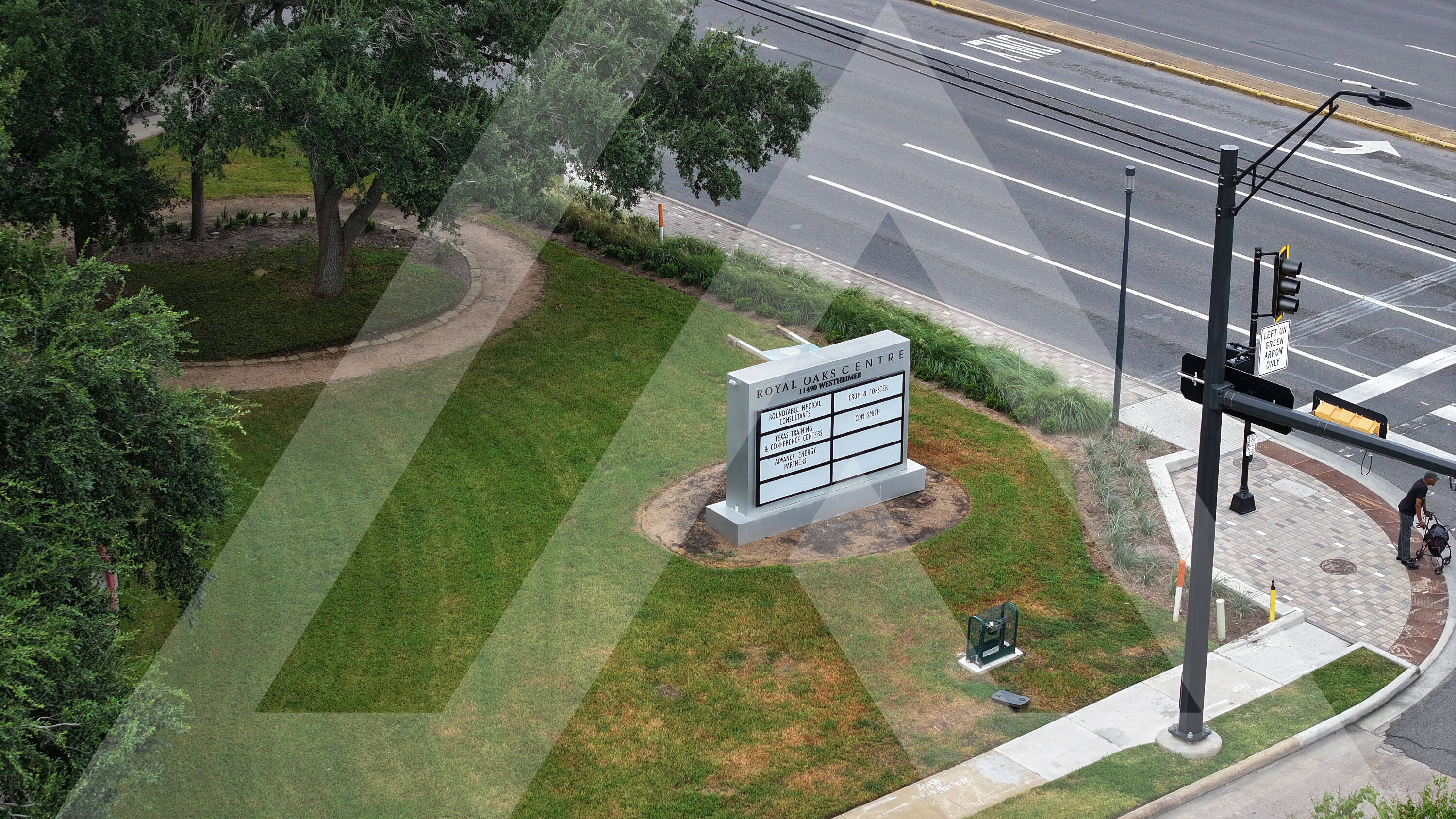 Aerial view of Royal Oaks Centre at 11490 Westheimer Rd, Houston, TX, showcasing its retail space and prominent signage.