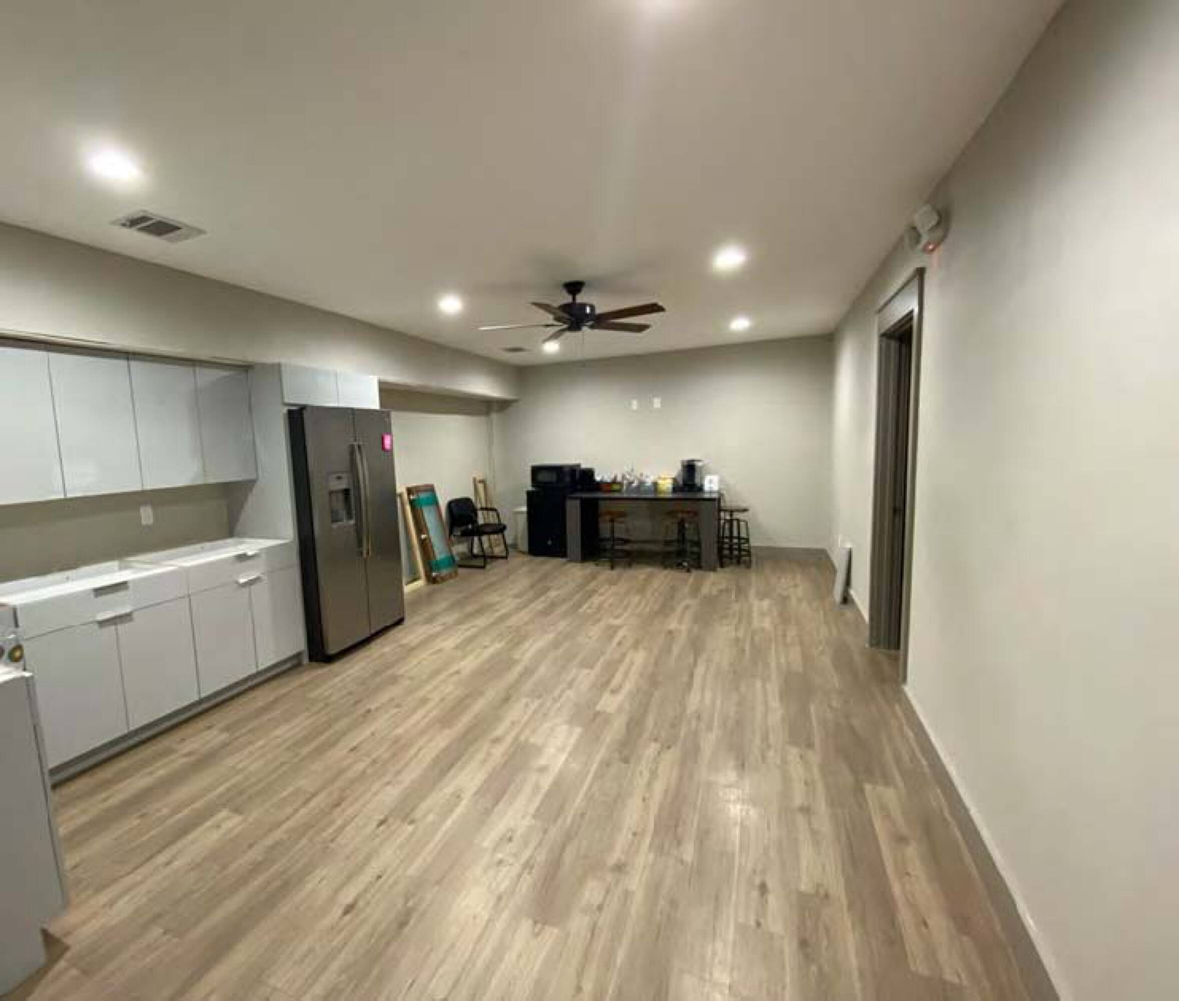Interior view of a modern office or light industrial space at James Place Business Park with wood flooring, kitchenette, and open layout.