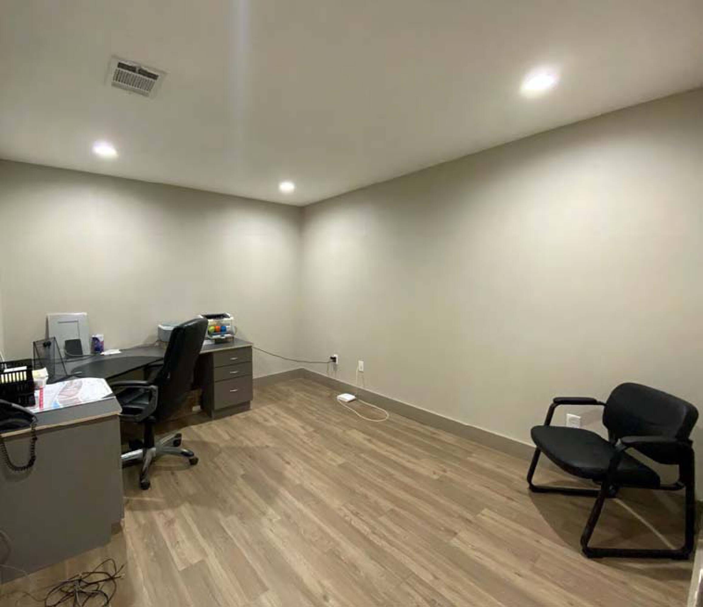 Office space within James Place Business Park featuring wood-like flooring and neutral walls.