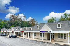 13402597