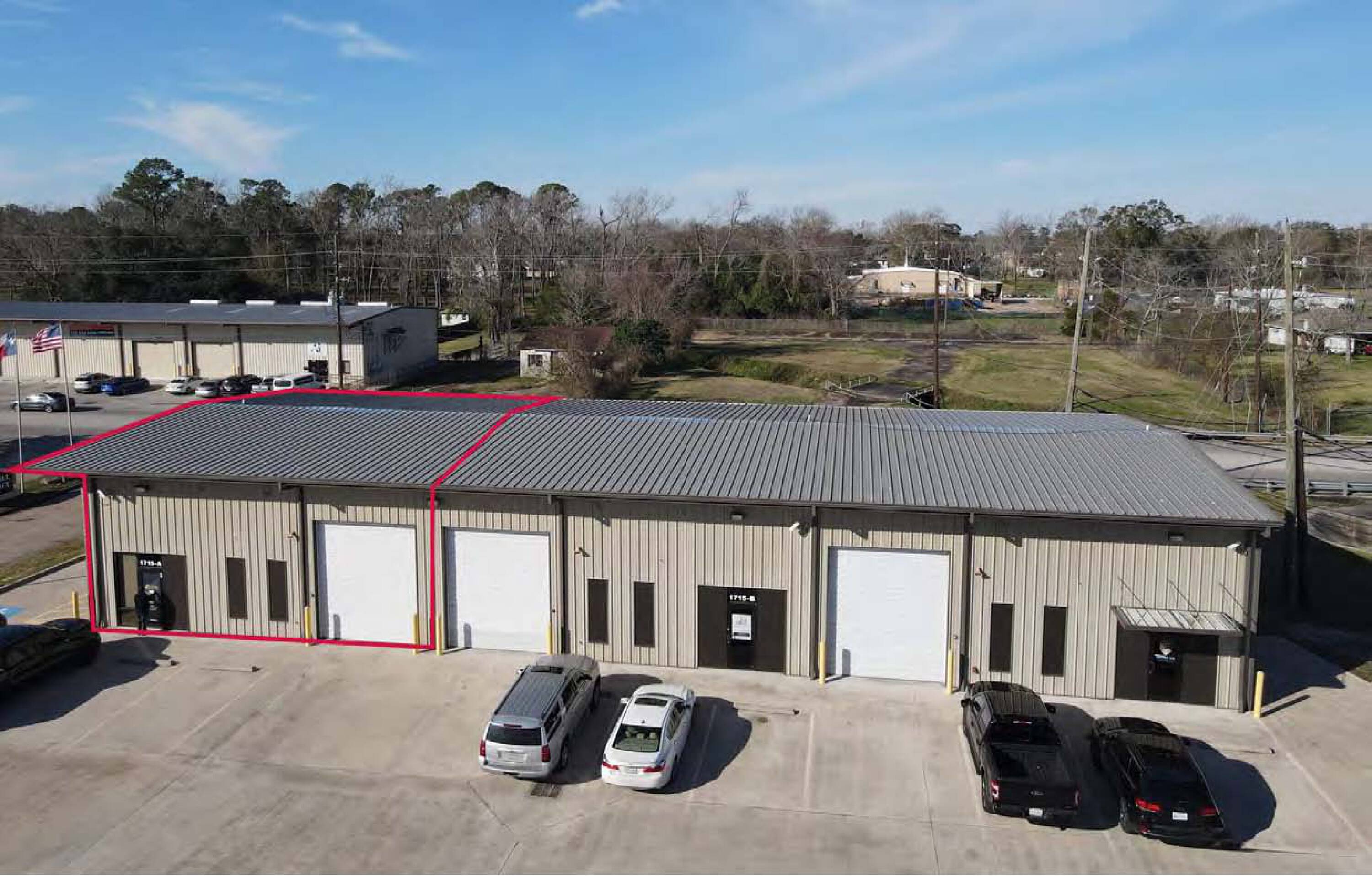 Aerial view of Suite A at 1715 Humble Pl Dr, Humble, TX, showcasing an industrial warehouse with ample parking and loading areas.