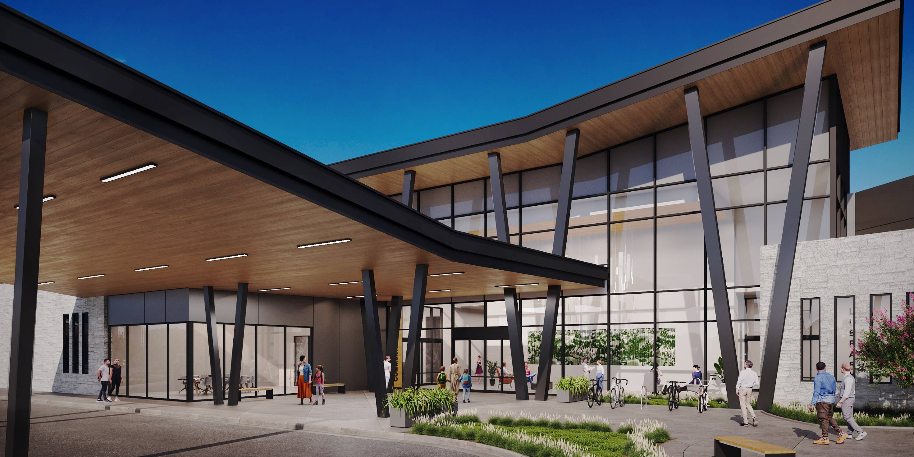 Modern retail center with large glass windows and covered walkway at Grogan's Mill Village Center.